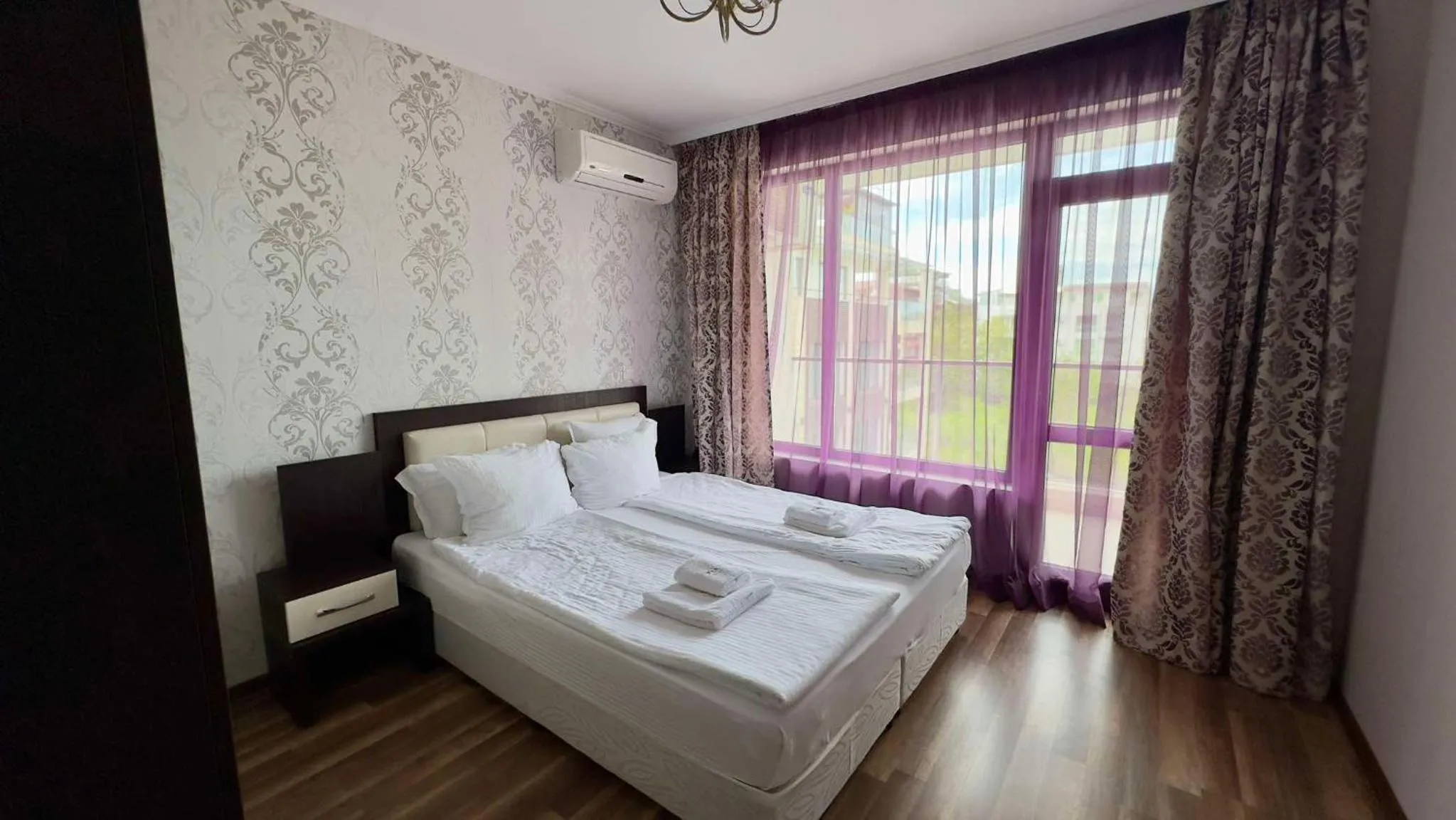 Bedroom, Bed in Green Paradise Deluxe Apartments
