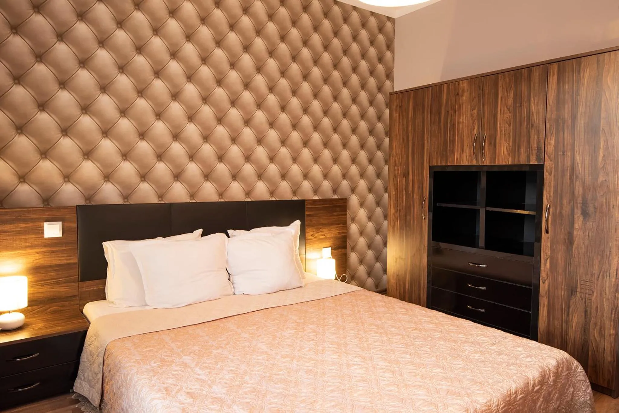 Bed in Green Paradise Deluxe Apartments