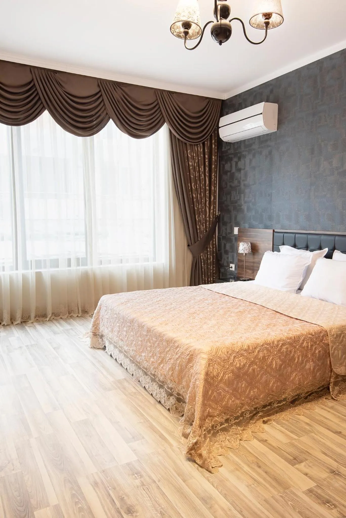Bed in Green Paradise Deluxe Apartments