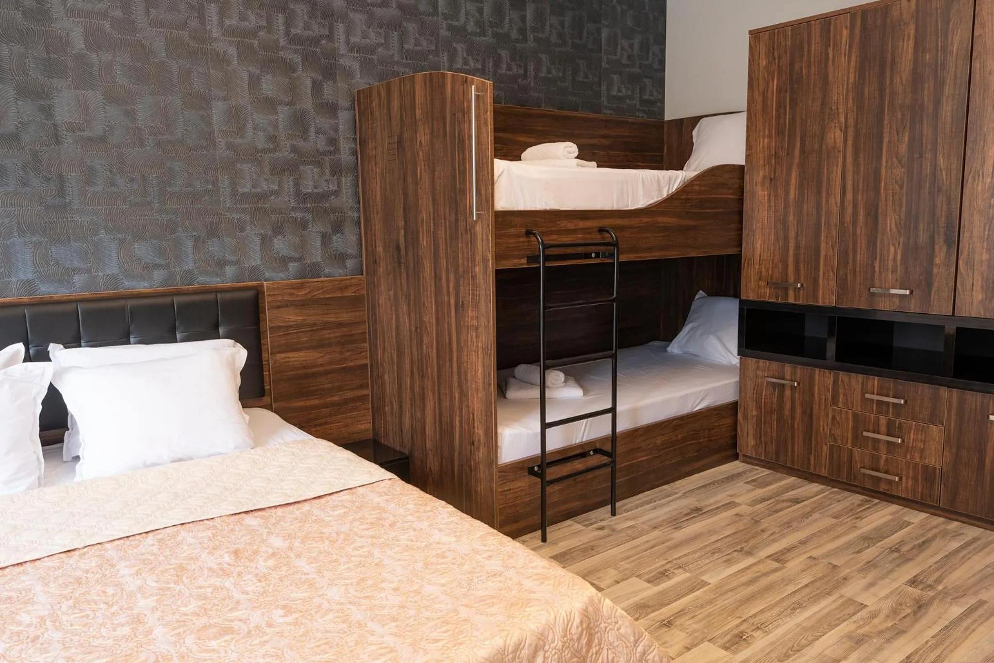 Bed in Green Paradise Deluxe Apartments