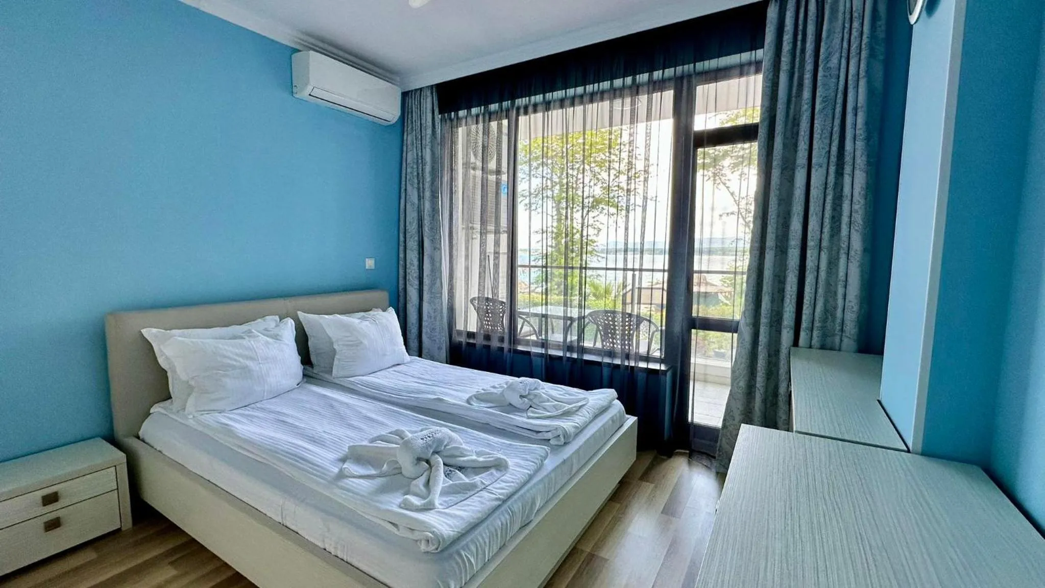 Bed in Green Paradise Deluxe Apartments