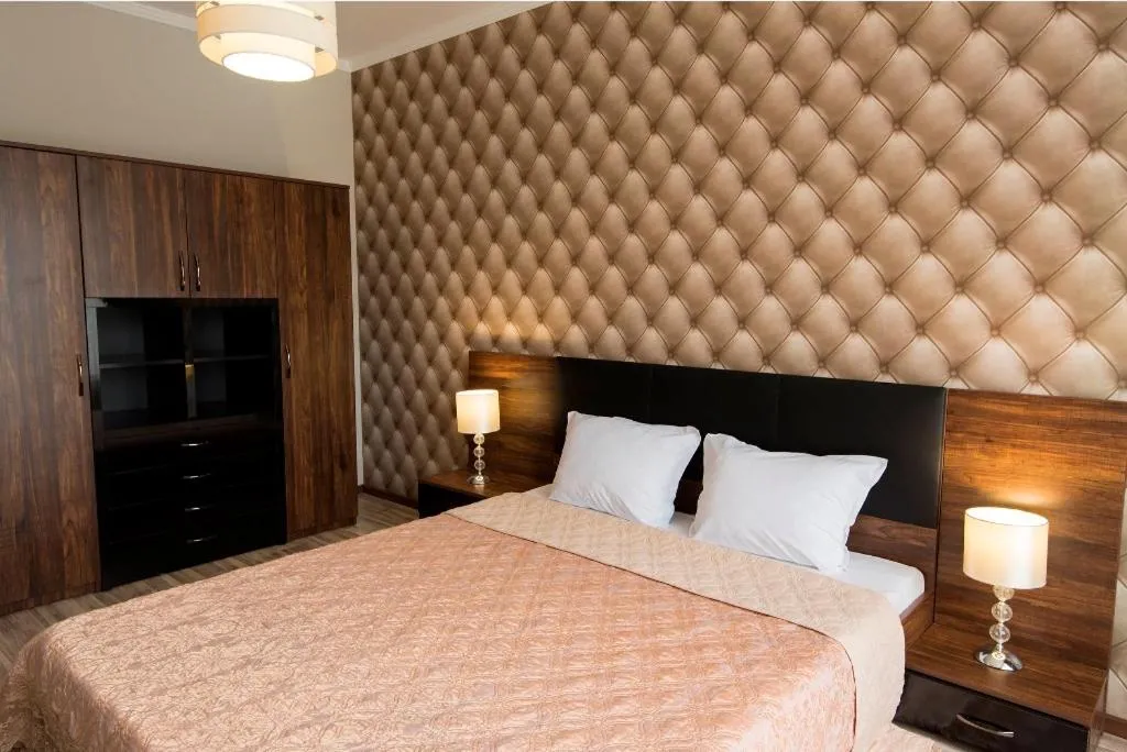 Bed in Green Paradise Deluxe Apartments