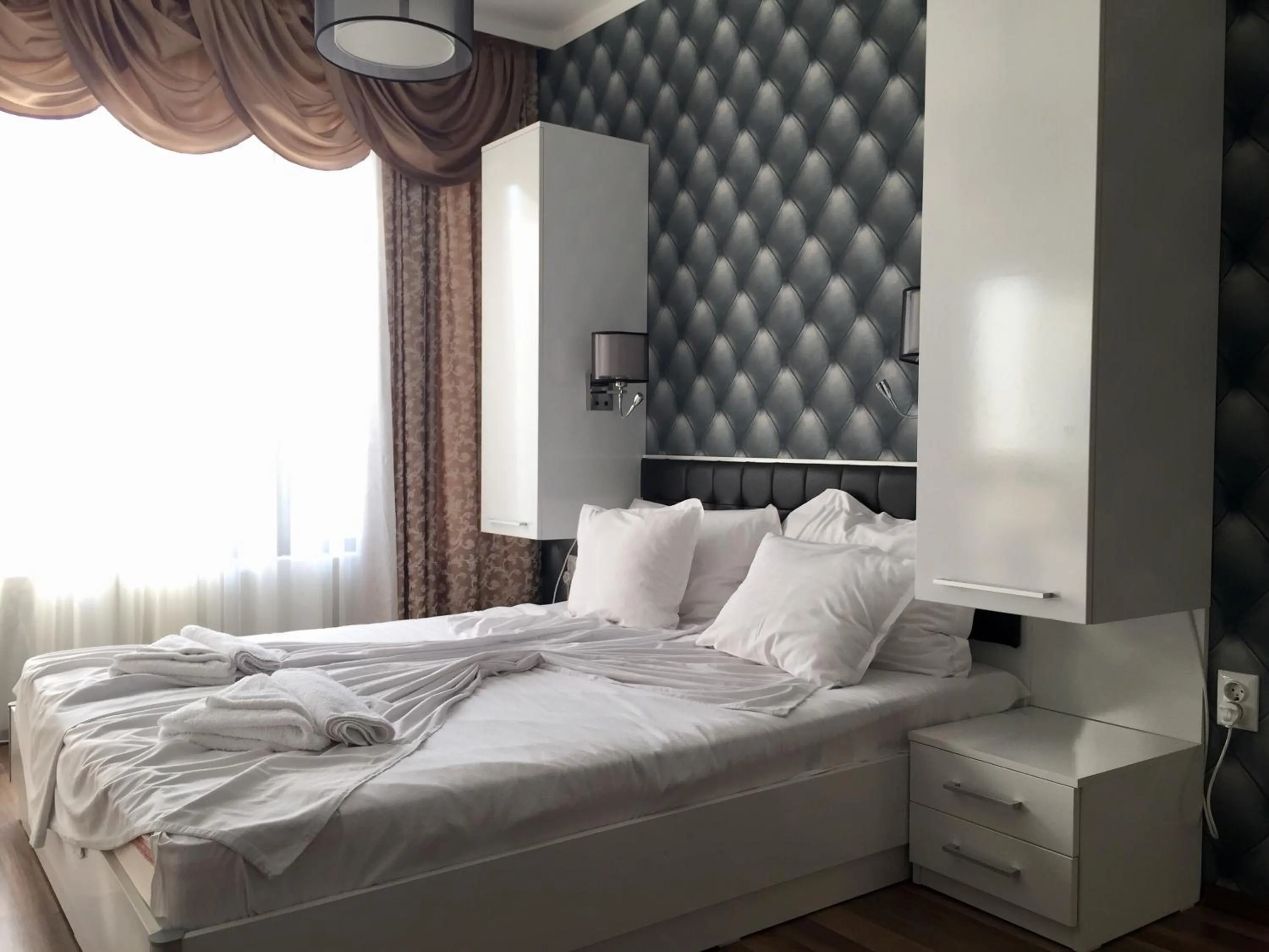 Bed in Green Paradise Deluxe Apartments
