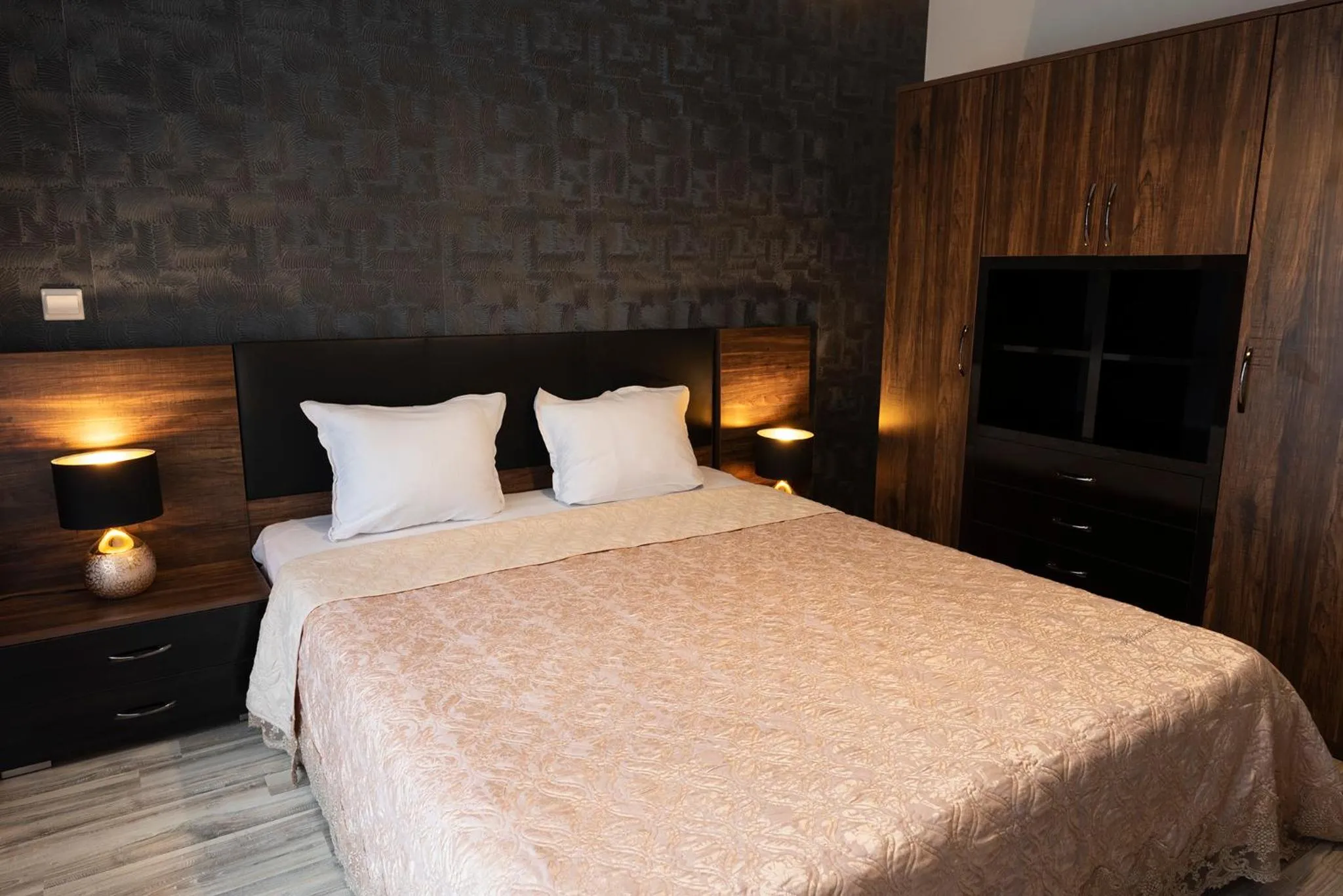 Bed in Green Paradise Deluxe Apartments