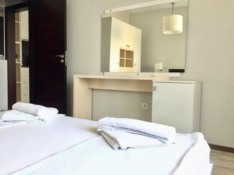 Bed in Green Paradise Deluxe Apartments