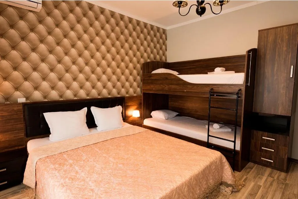 Bed in Green Paradise Deluxe Apartments
