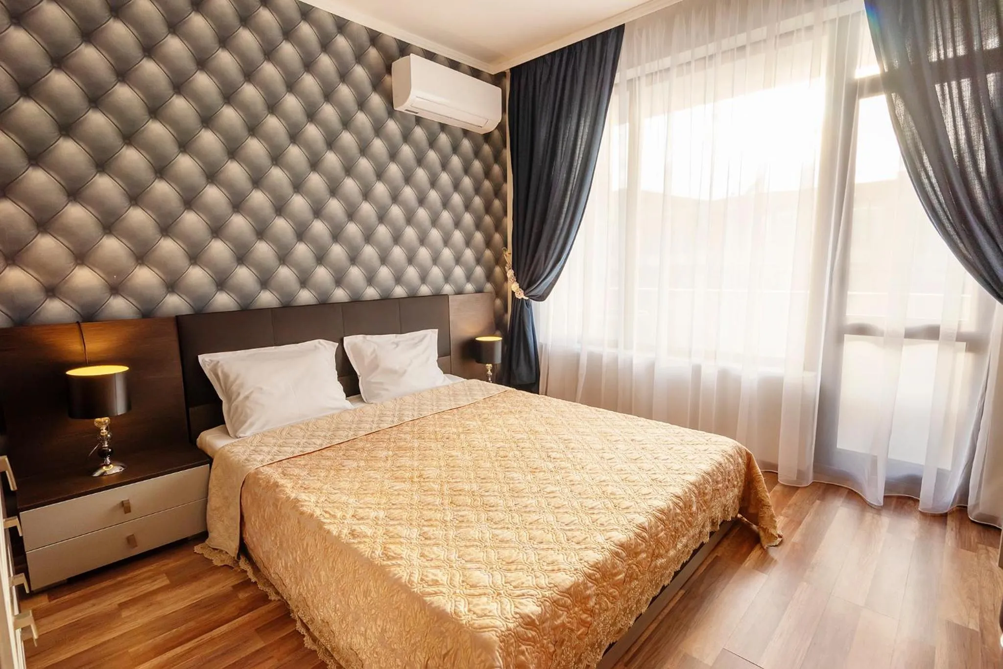 Bed in Green Paradise Deluxe Apartments