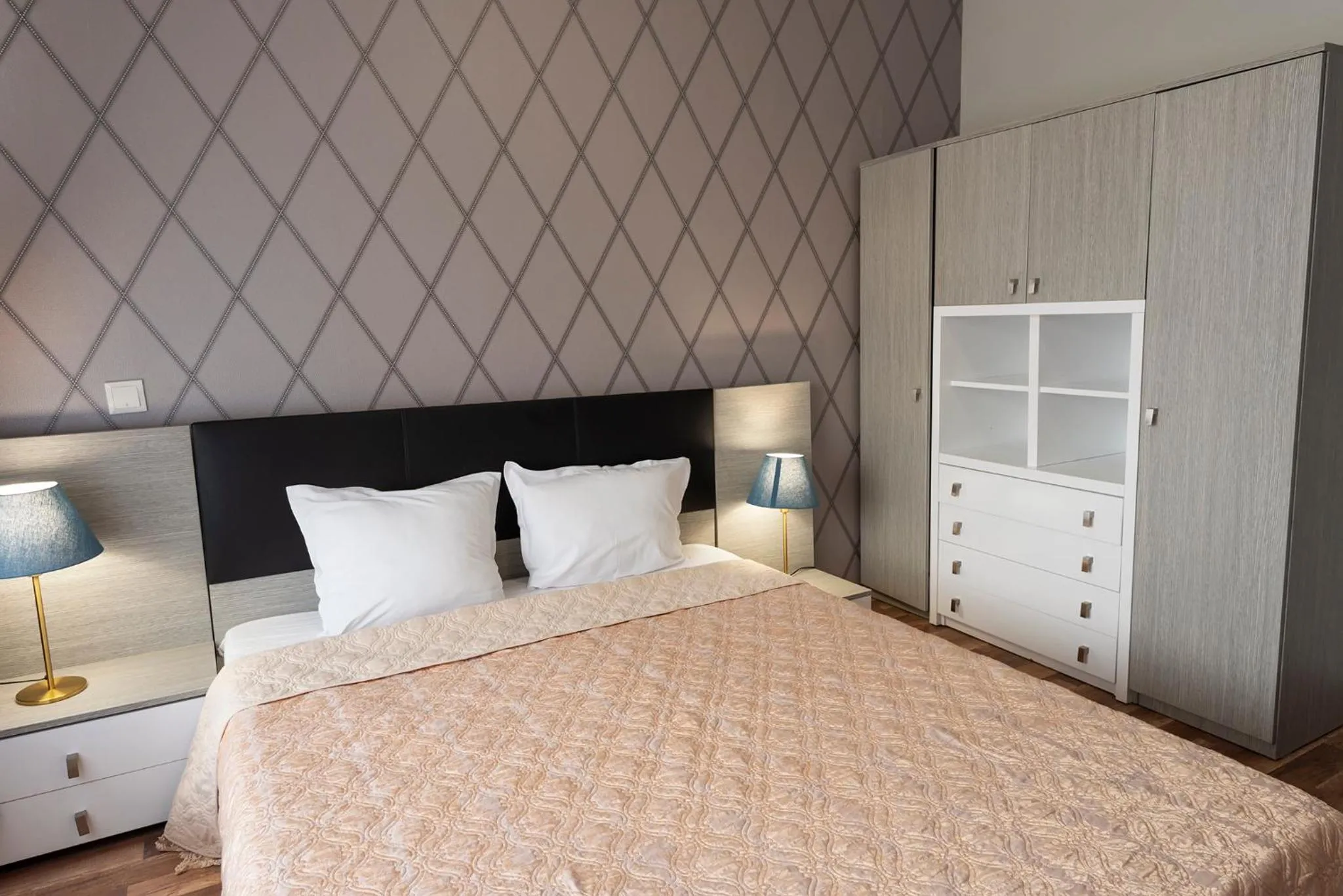 Bed in Green Paradise Deluxe Apartments