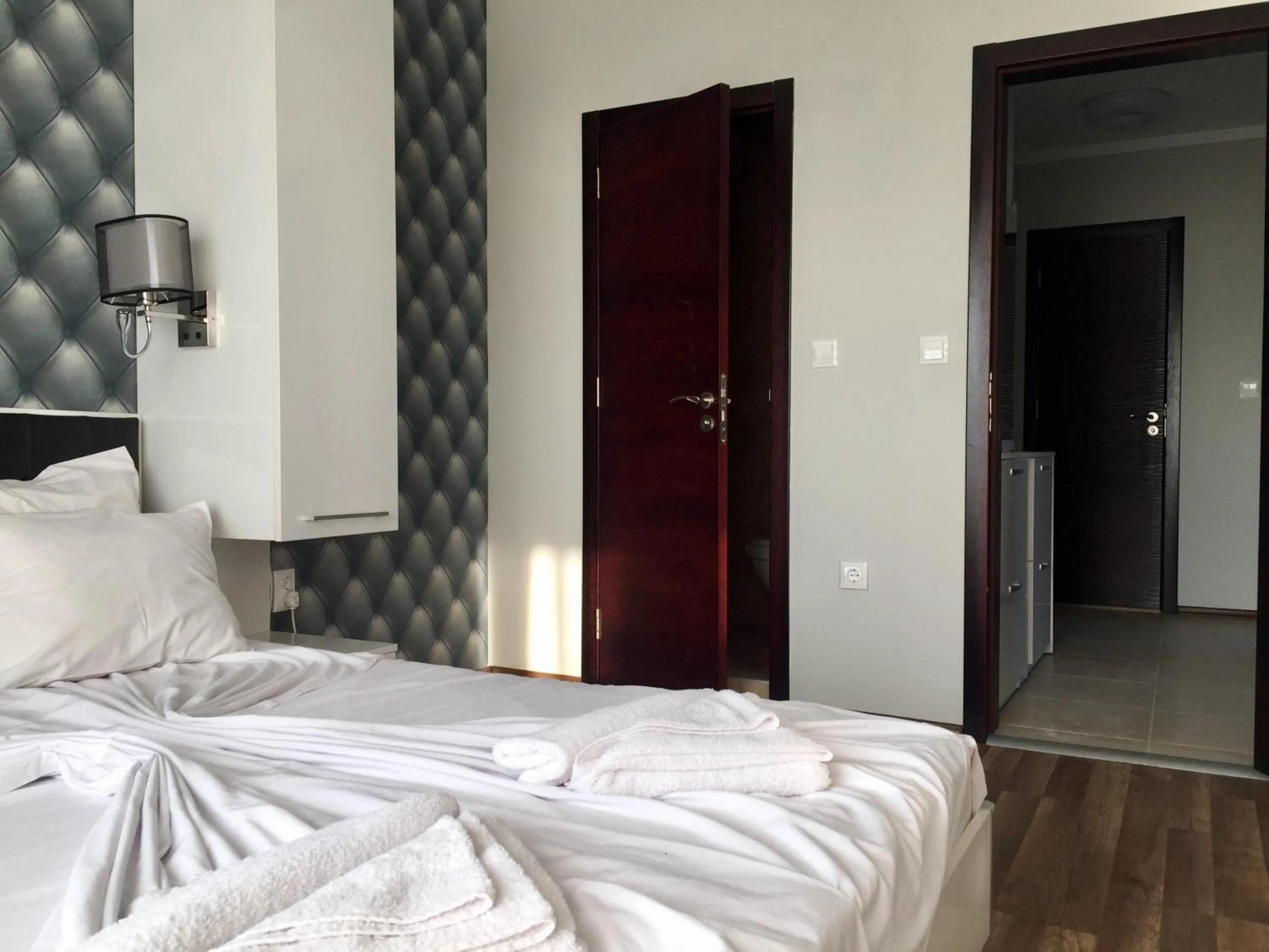 Bed in Green Paradise Deluxe Apartments