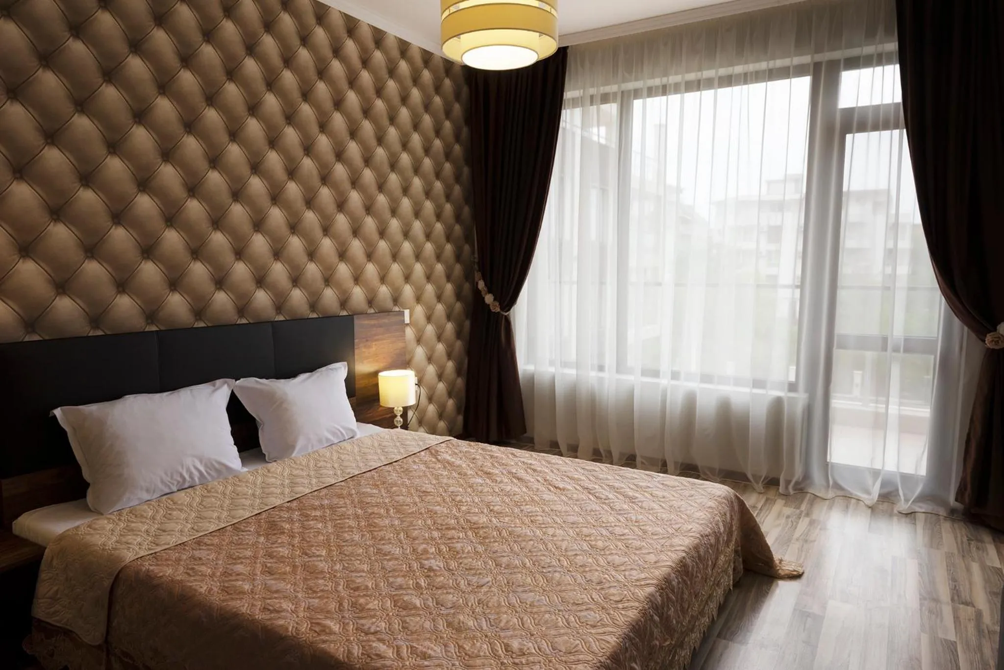 Bedroom, Bed in Green Paradise Deluxe Apartments