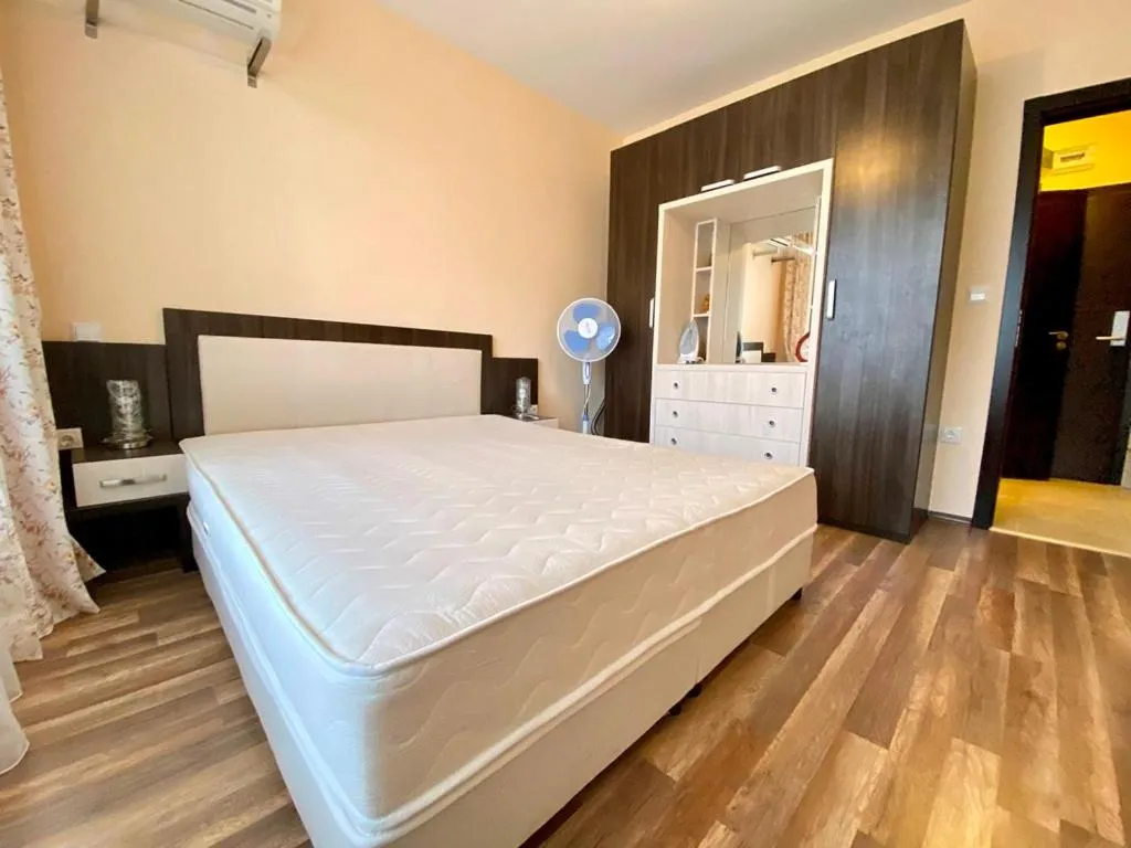 Bed in Green Paradise Deluxe Apartments