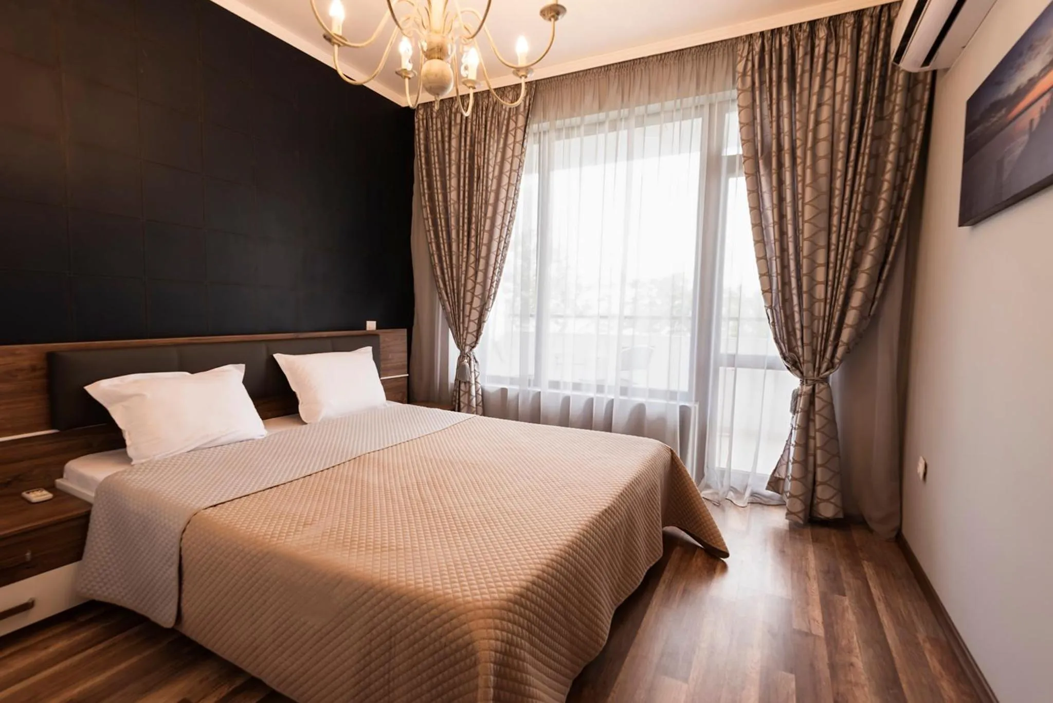 Photo of the whole room, Bed in Green Paradise Deluxe Apartments