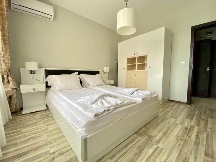 Bed in Green Paradise Deluxe Apartments