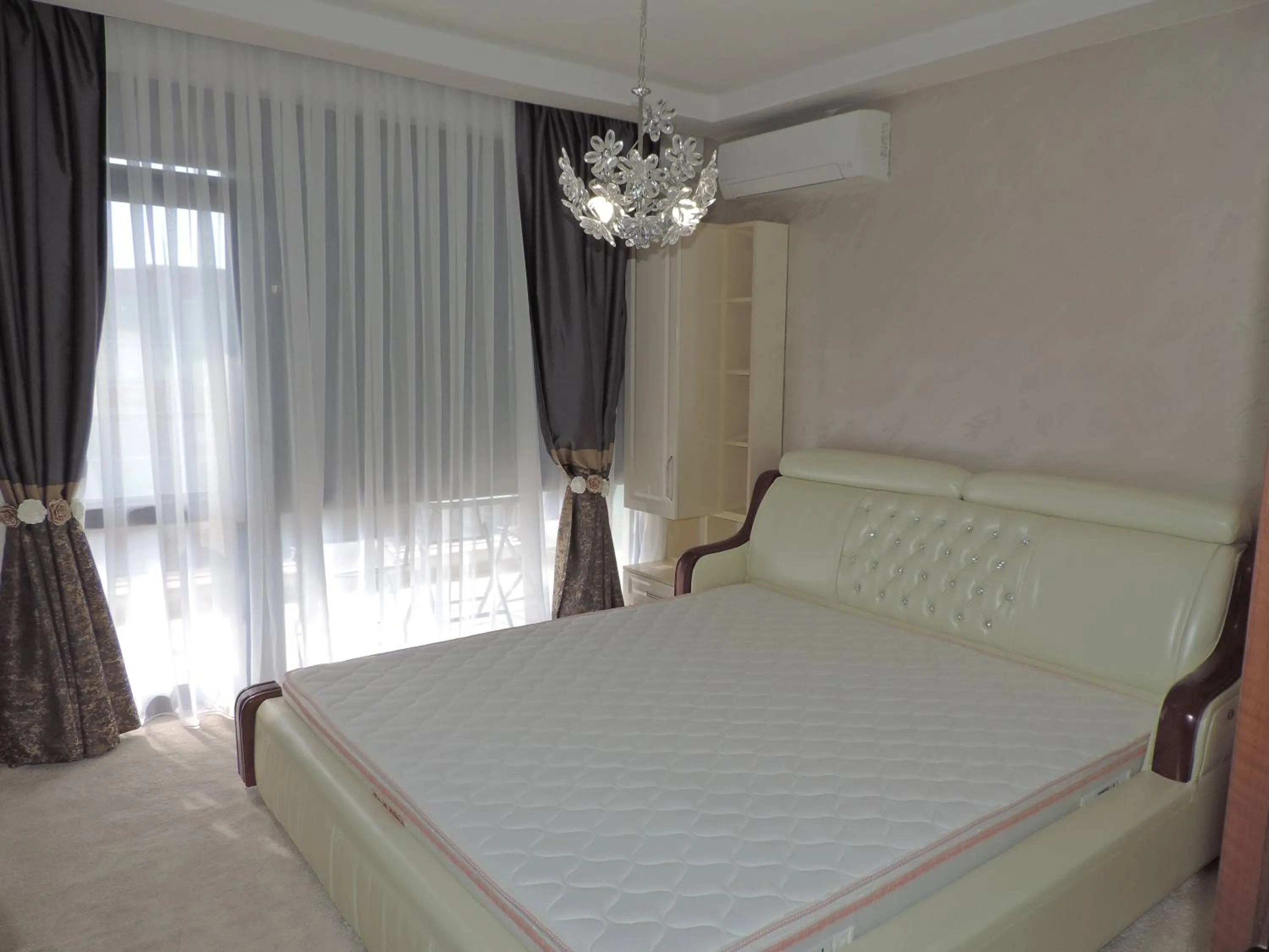 Bed in Green Paradise Deluxe Apartments