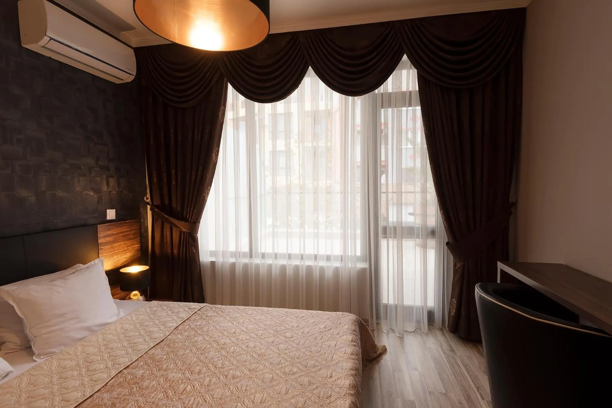 Bed in Green Paradise Deluxe Apartments