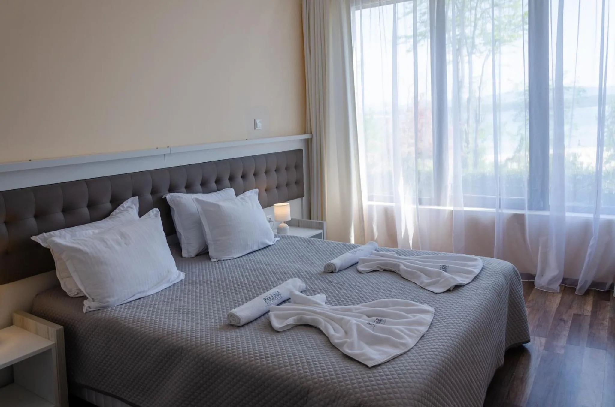 Bed in Green Paradise Deluxe Apartments
