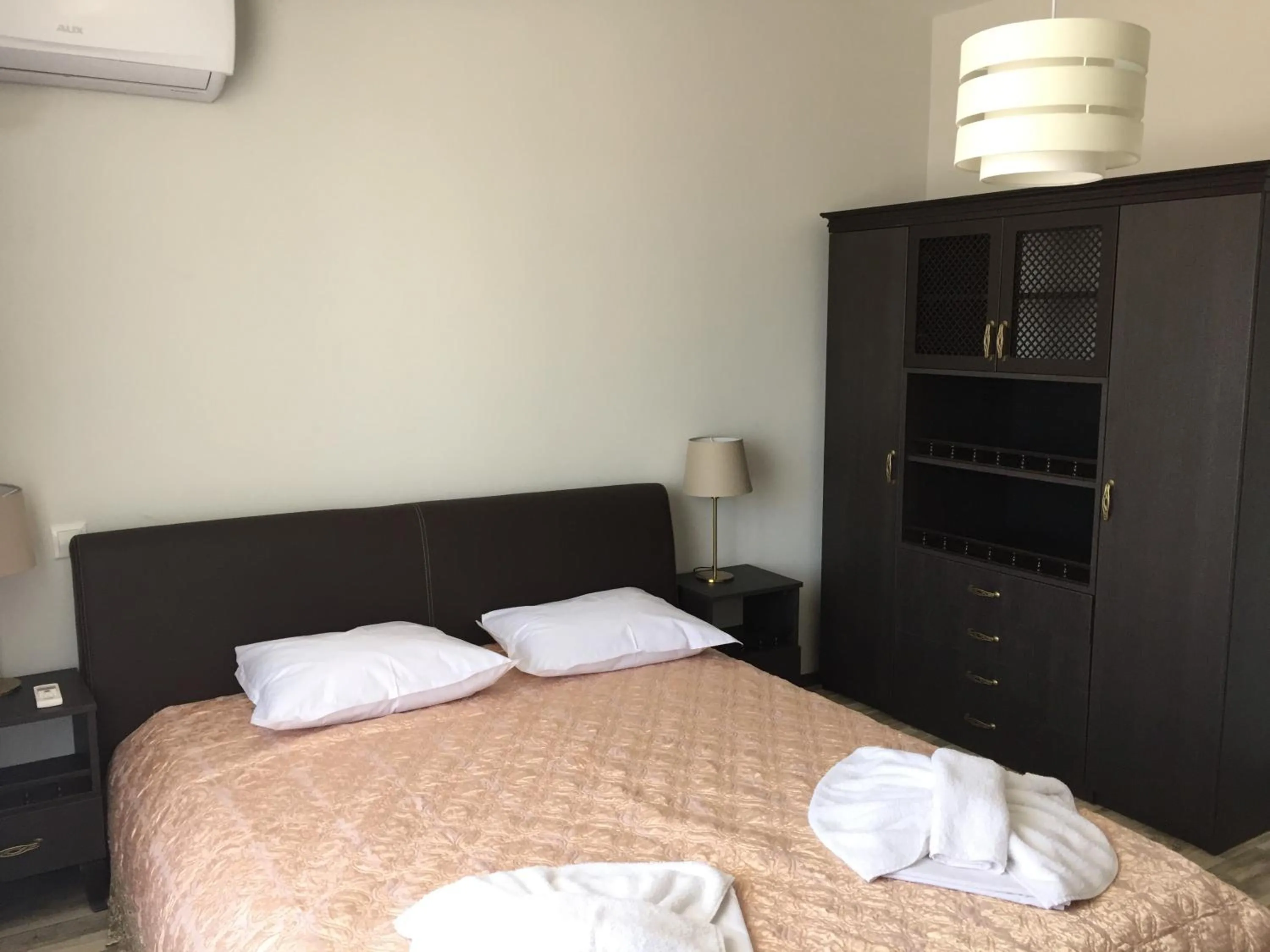 Bed in Green Paradise Deluxe Apartments