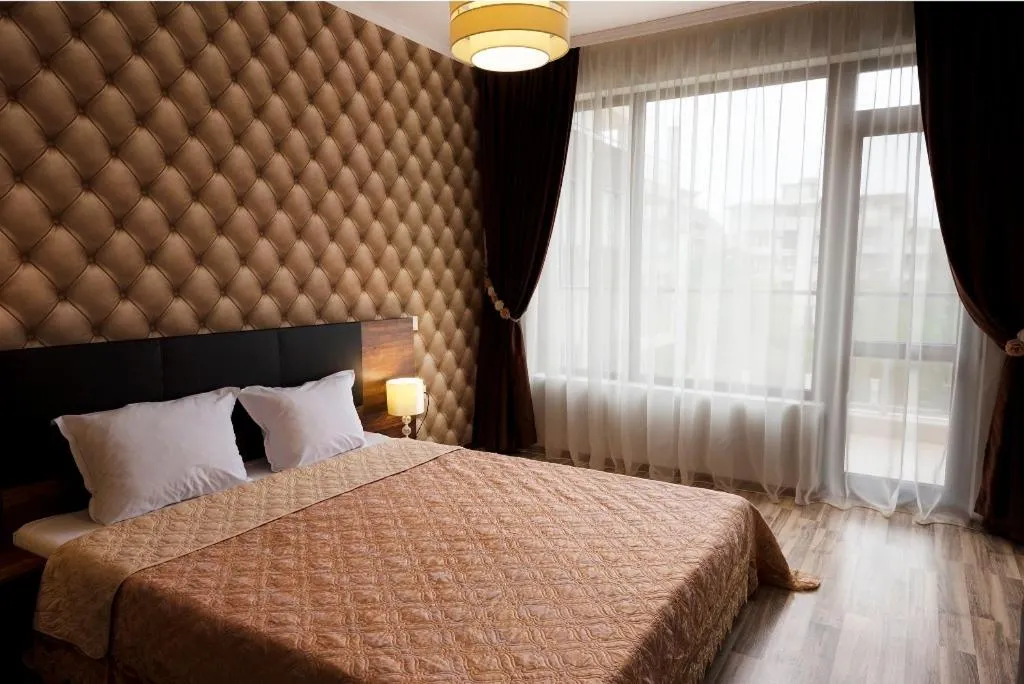 Bed in Green Paradise Deluxe Apartments