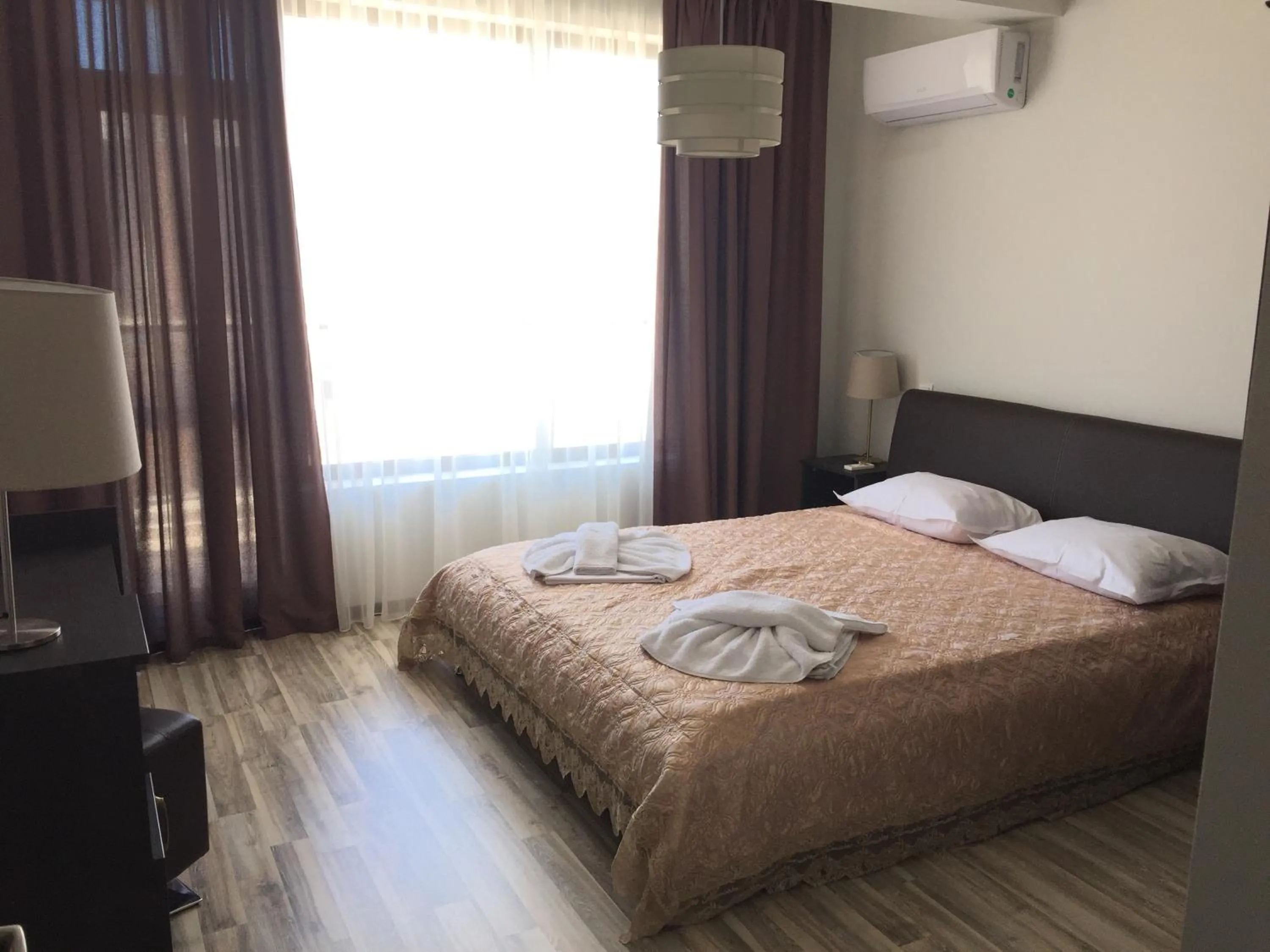 Bed in Green Paradise Deluxe Apartments