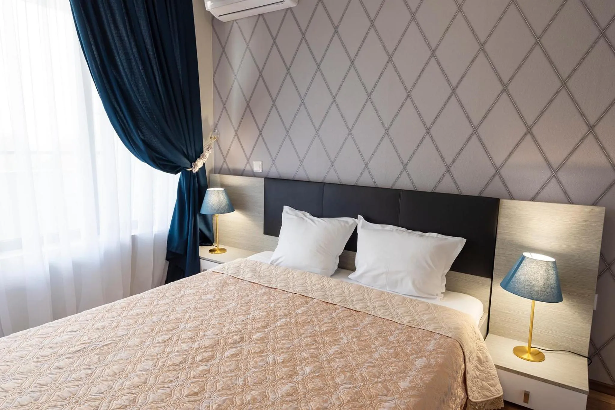 Bed in Green Paradise Deluxe Apartments