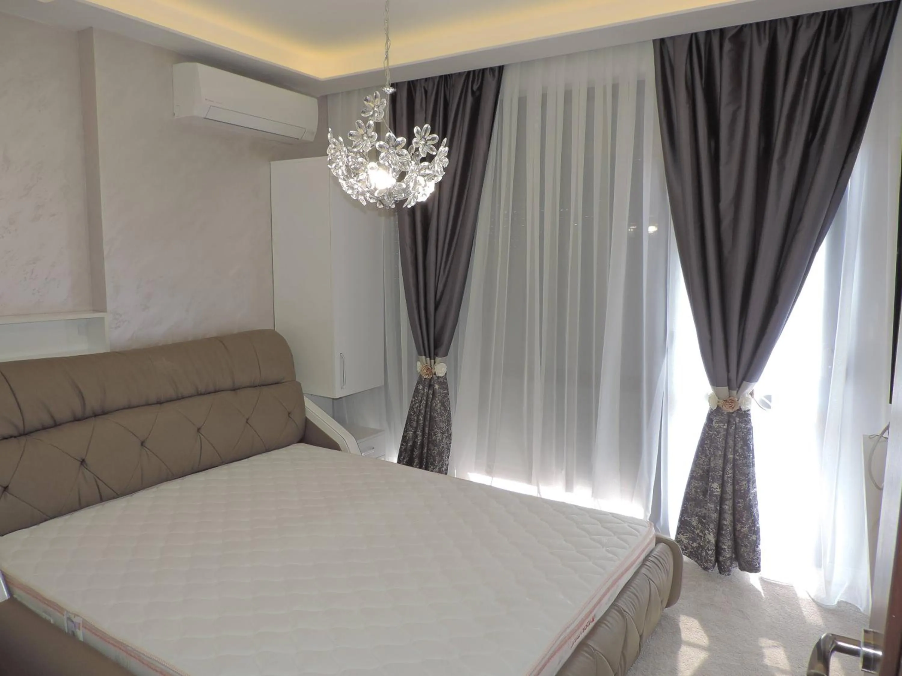 Bed in Green Paradise Deluxe Apartments