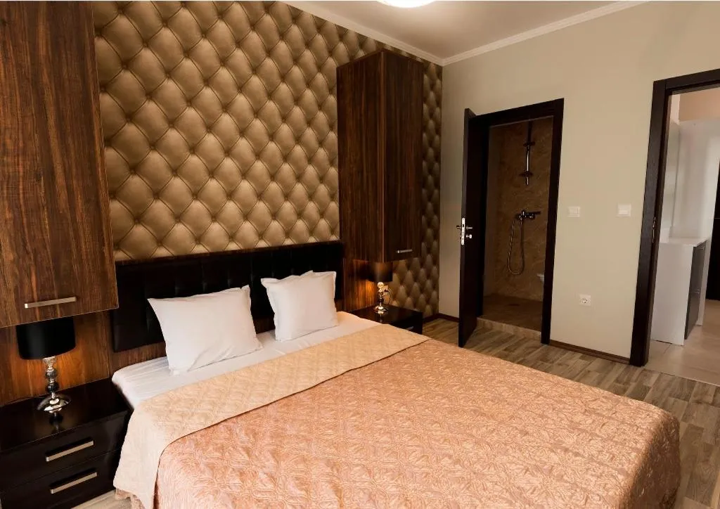 Bed in Green Paradise Deluxe Apartments