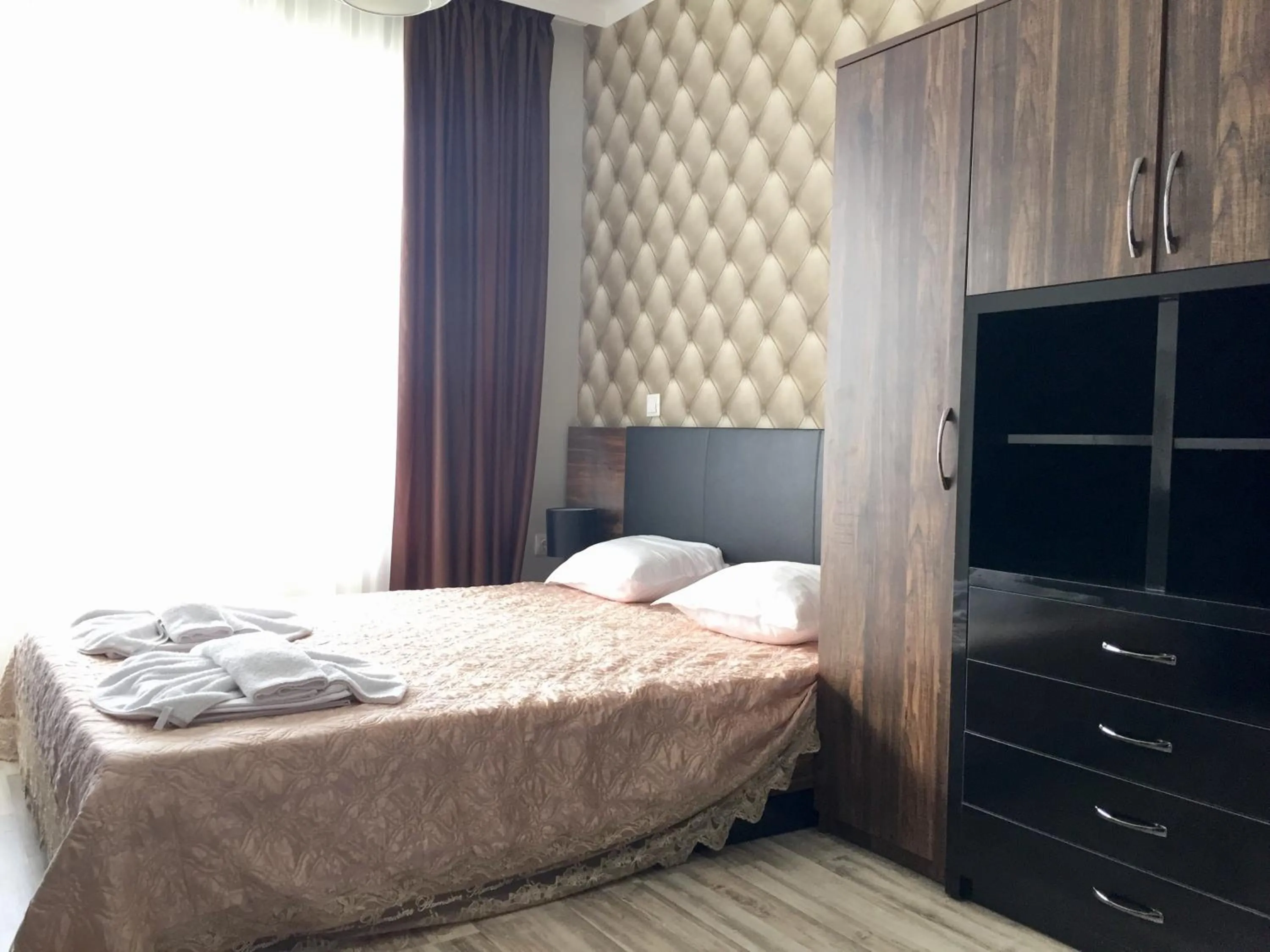 Bed in Green Paradise Deluxe Apartments