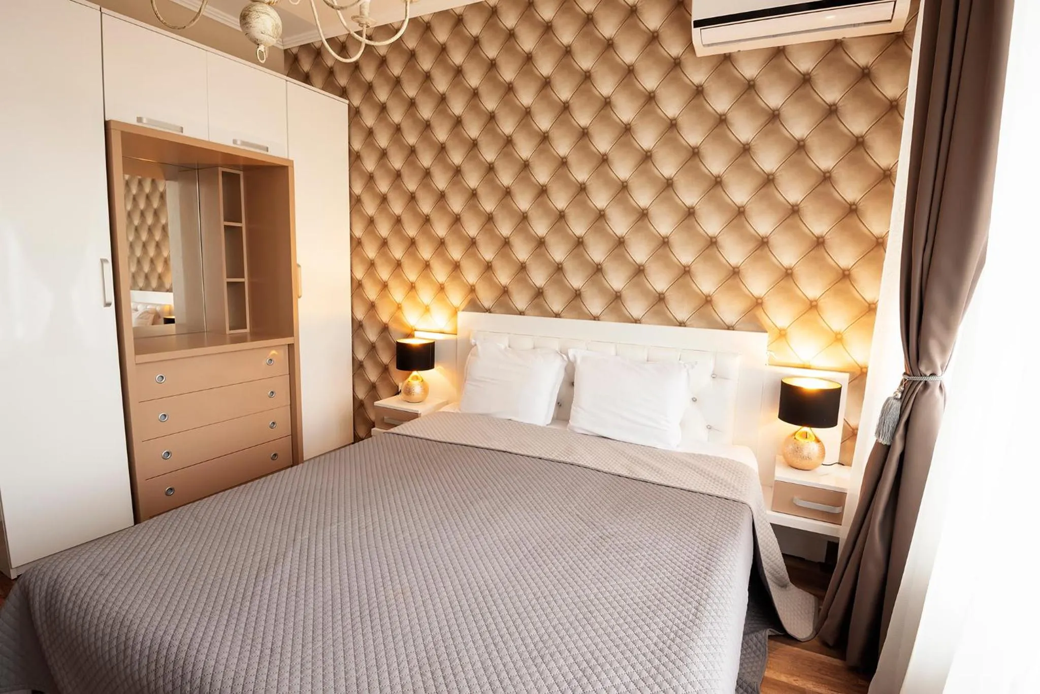 Bed in Green Paradise Deluxe Apartments