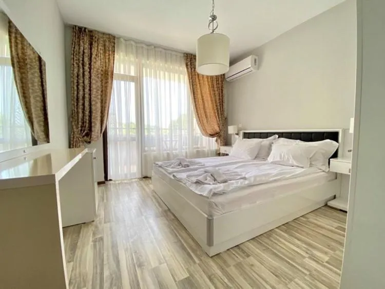 Bed in Green Paradise Deluxe Apartments