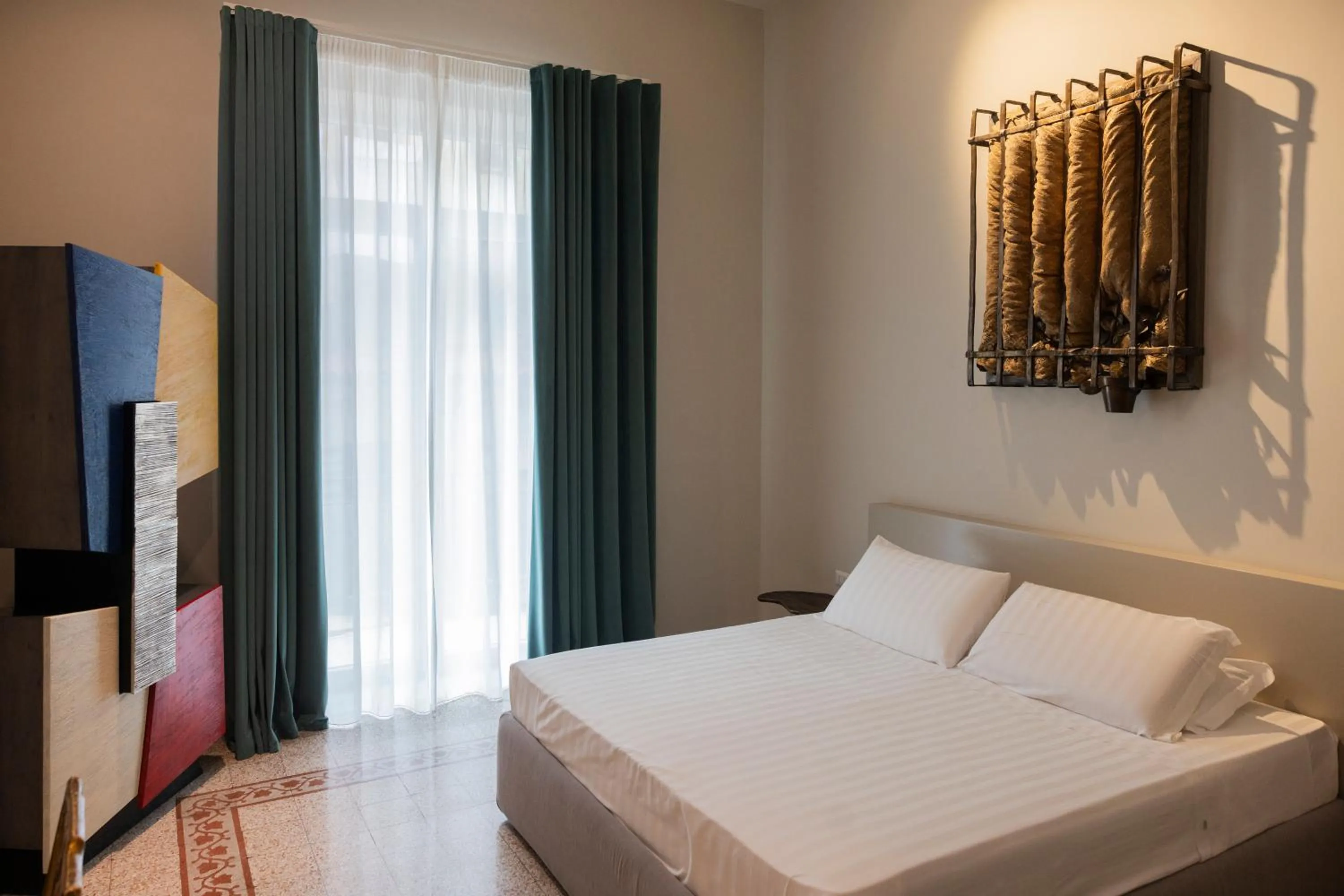 Bed in Atelier Inès Arts & Suites