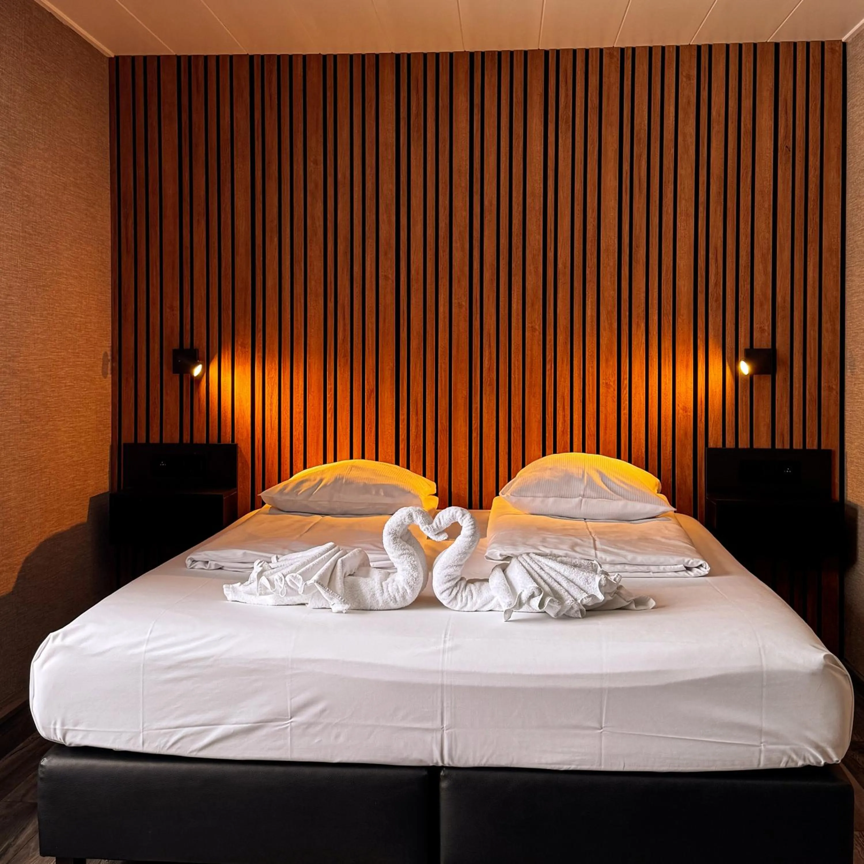 Bed in RAVeL Hotel Cyrano