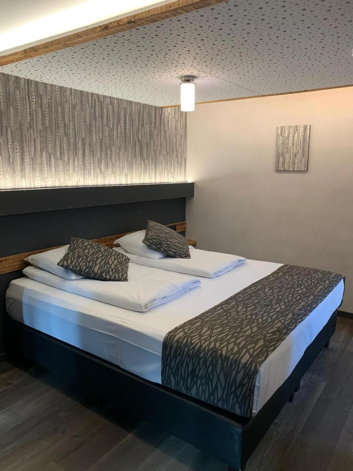 Bed in RAVeL Hotel Cyrano