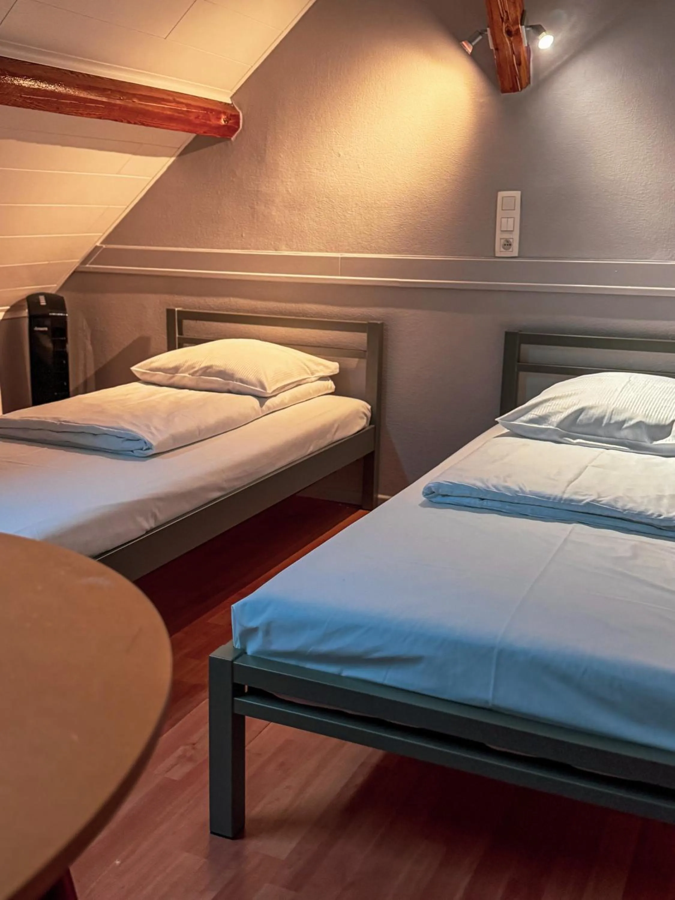 Bed in RAVeL Hotel Cyrano