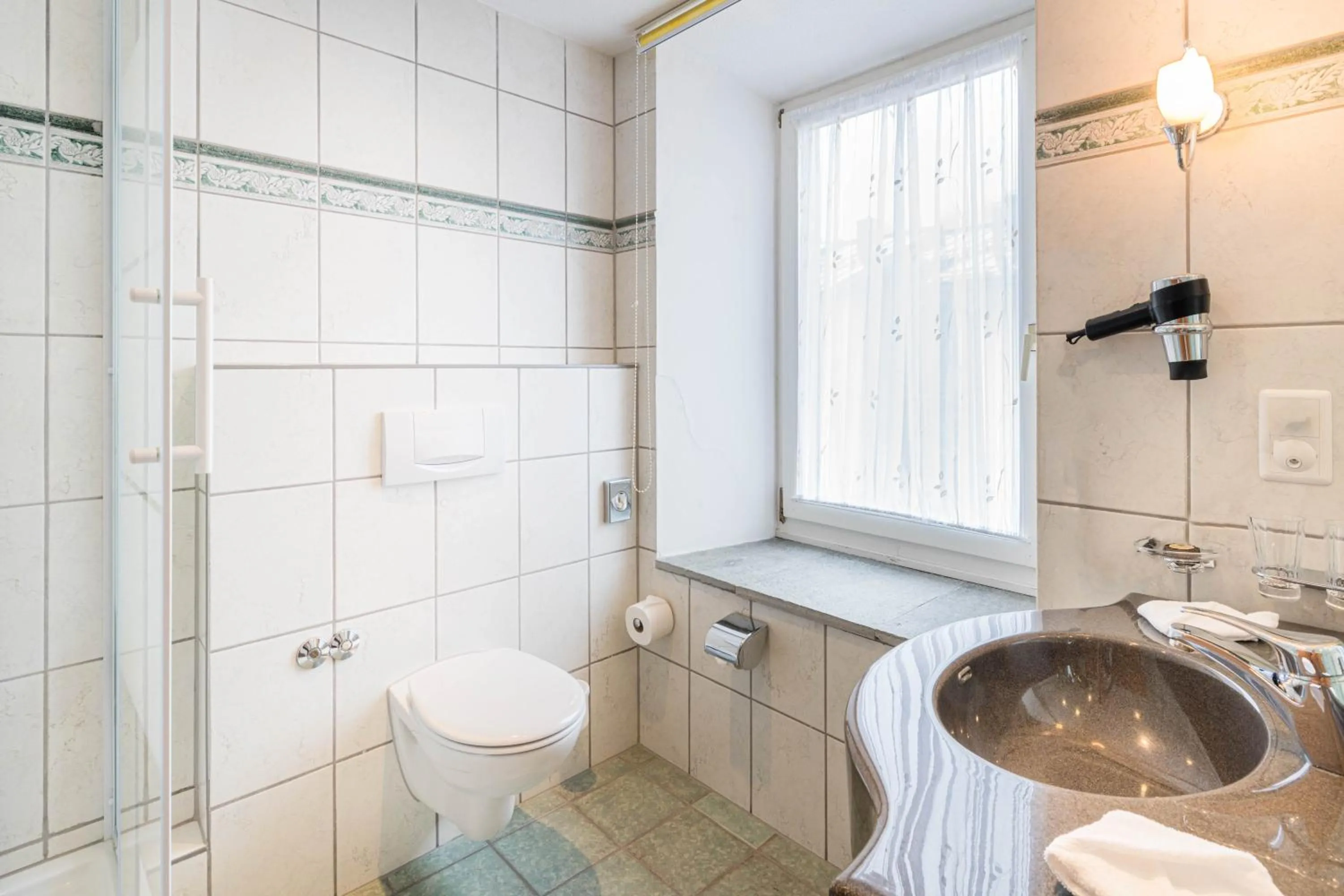 Shower in Boutique Hotel Engadinerhof - A Home for Generations