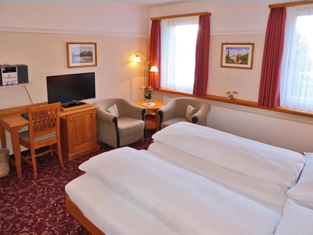 Photo of the whole room, Bed in Boutique Hotel Engadinerhof - A Home for Generations
