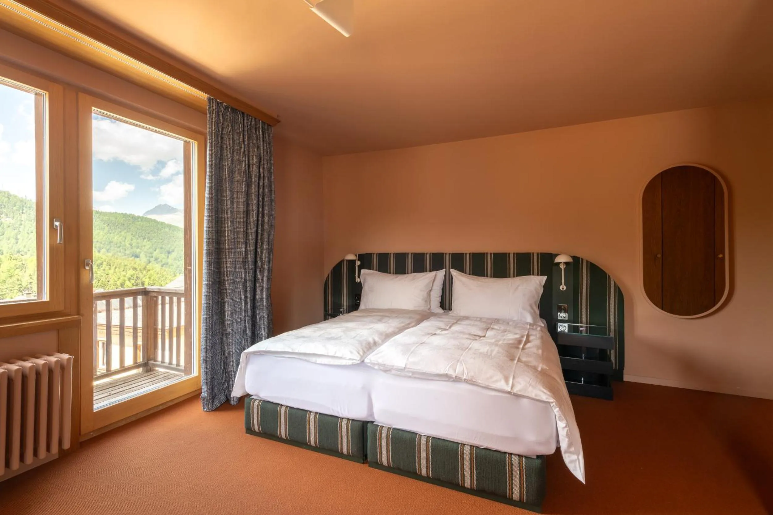 Bed in Boutique Hotel Engadinerhof - A Home for Generations