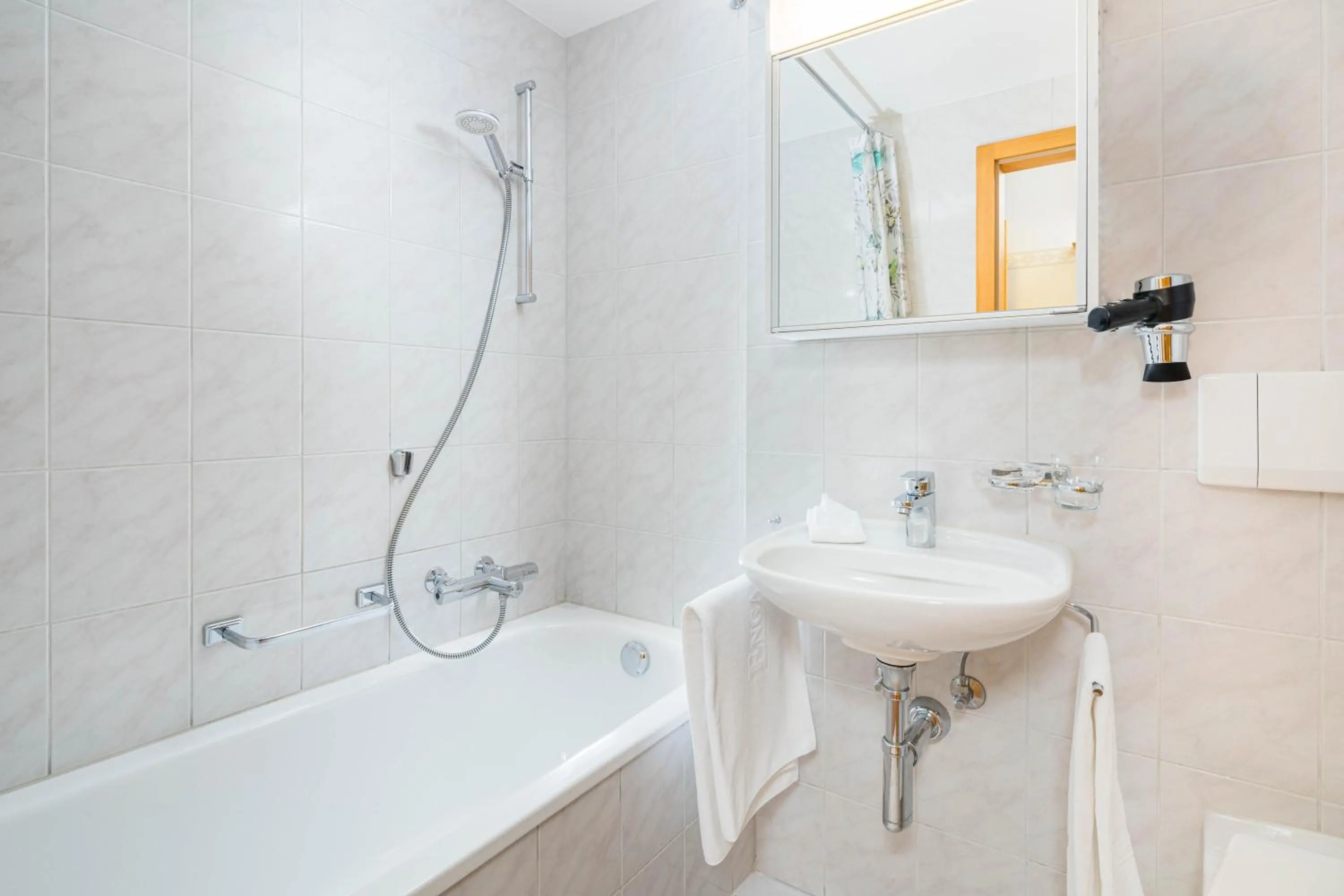 Bathroom in Boutique Hotel Engadinerhof - A Home for Generations
