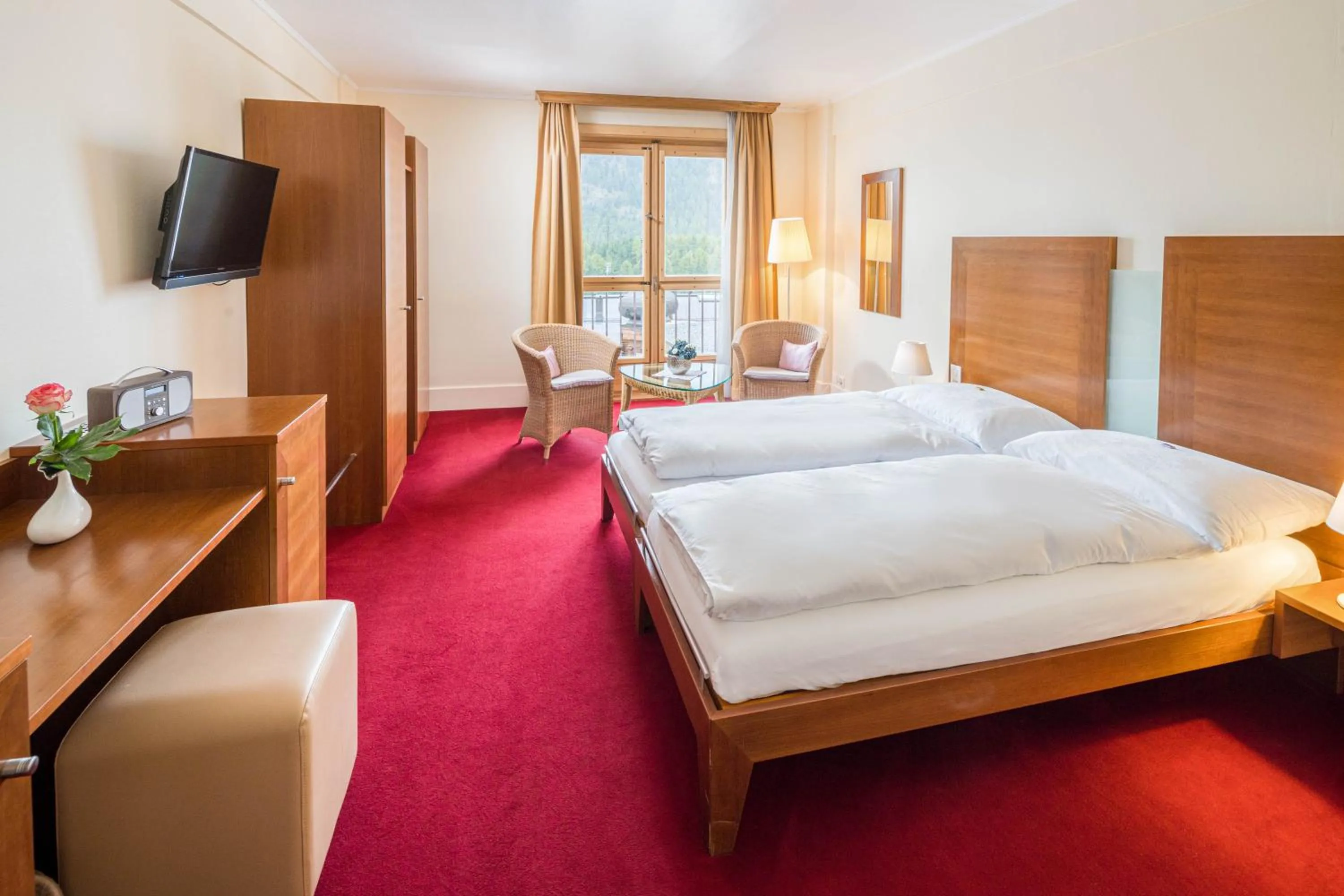 Photo of the whole room, Bed in Boutique Hotel Engadinerhof - A Home for Generations