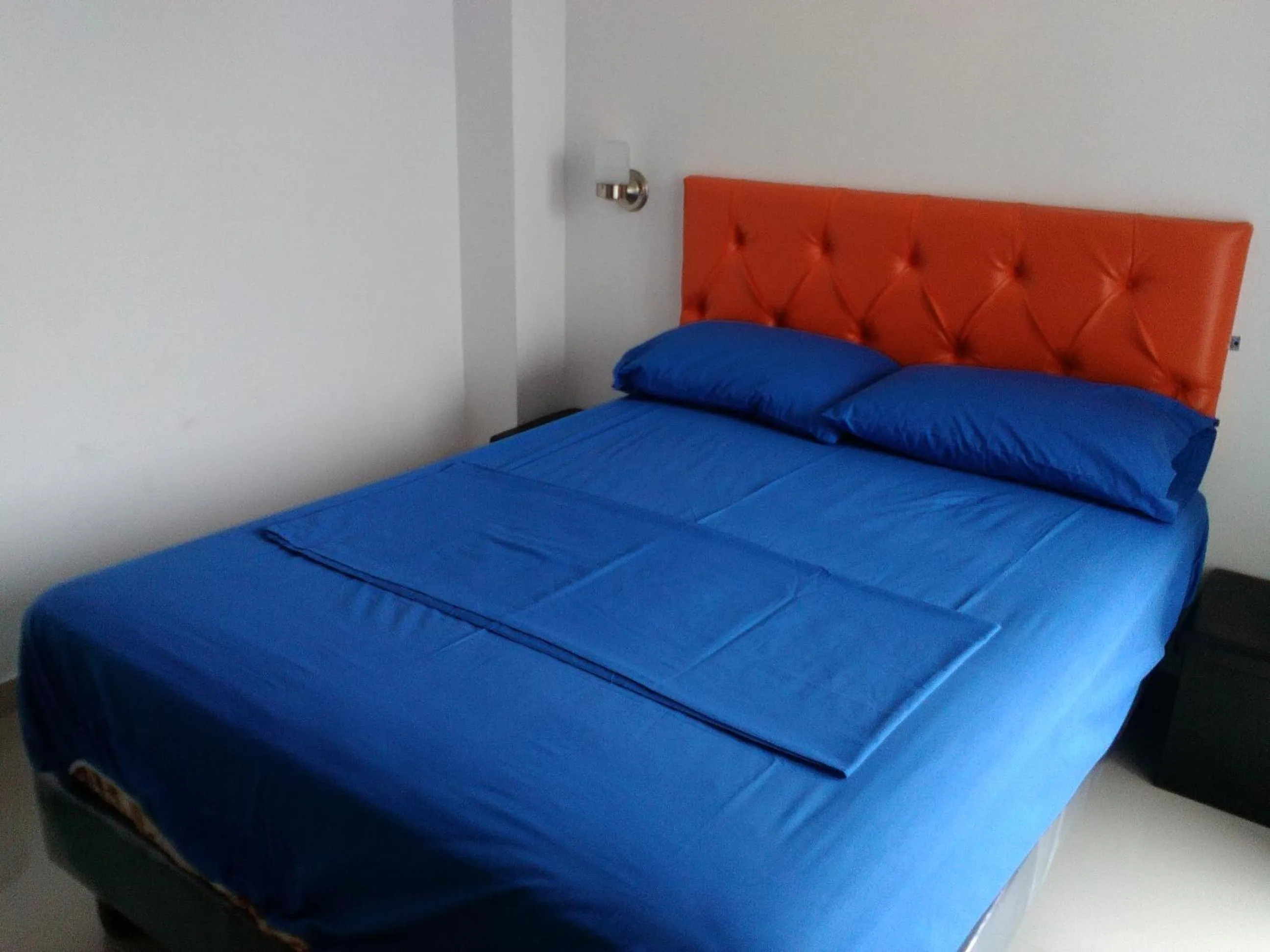 Bed in Hotel Almond Beach