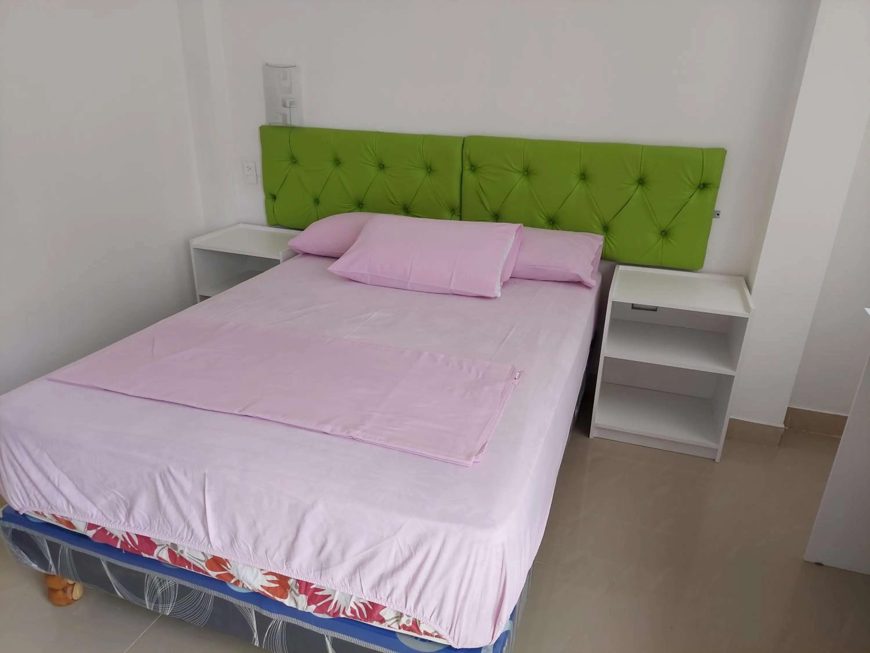 Bed in Hotel Almond Beach