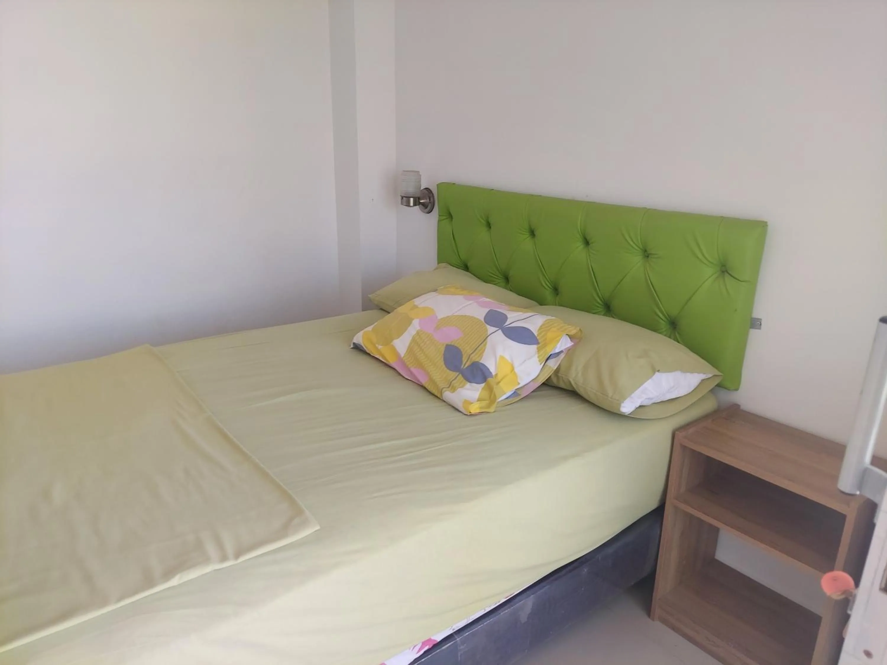 Bed in Hotel Almond Beach