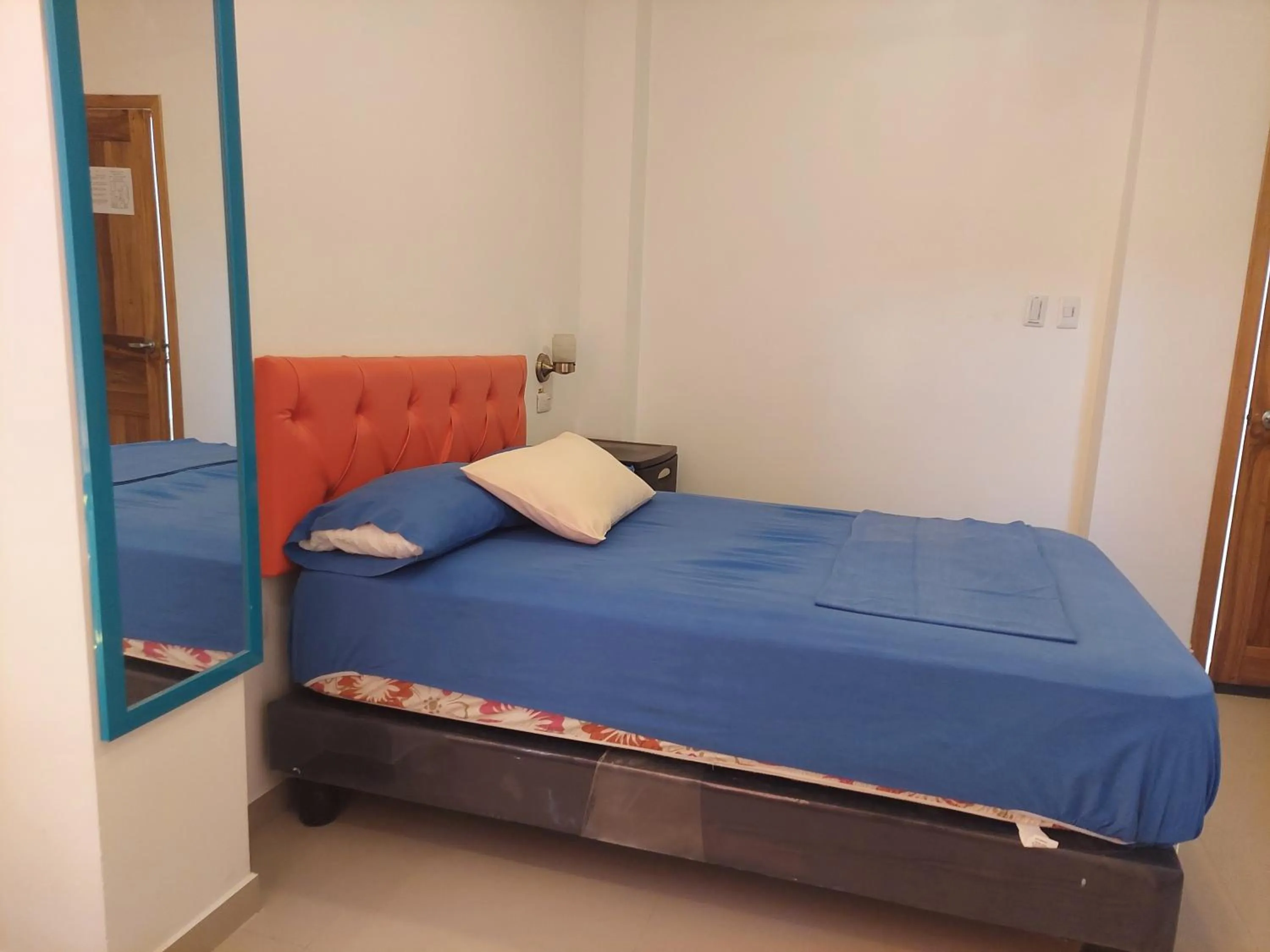 Bed in Hotel Almond Beach