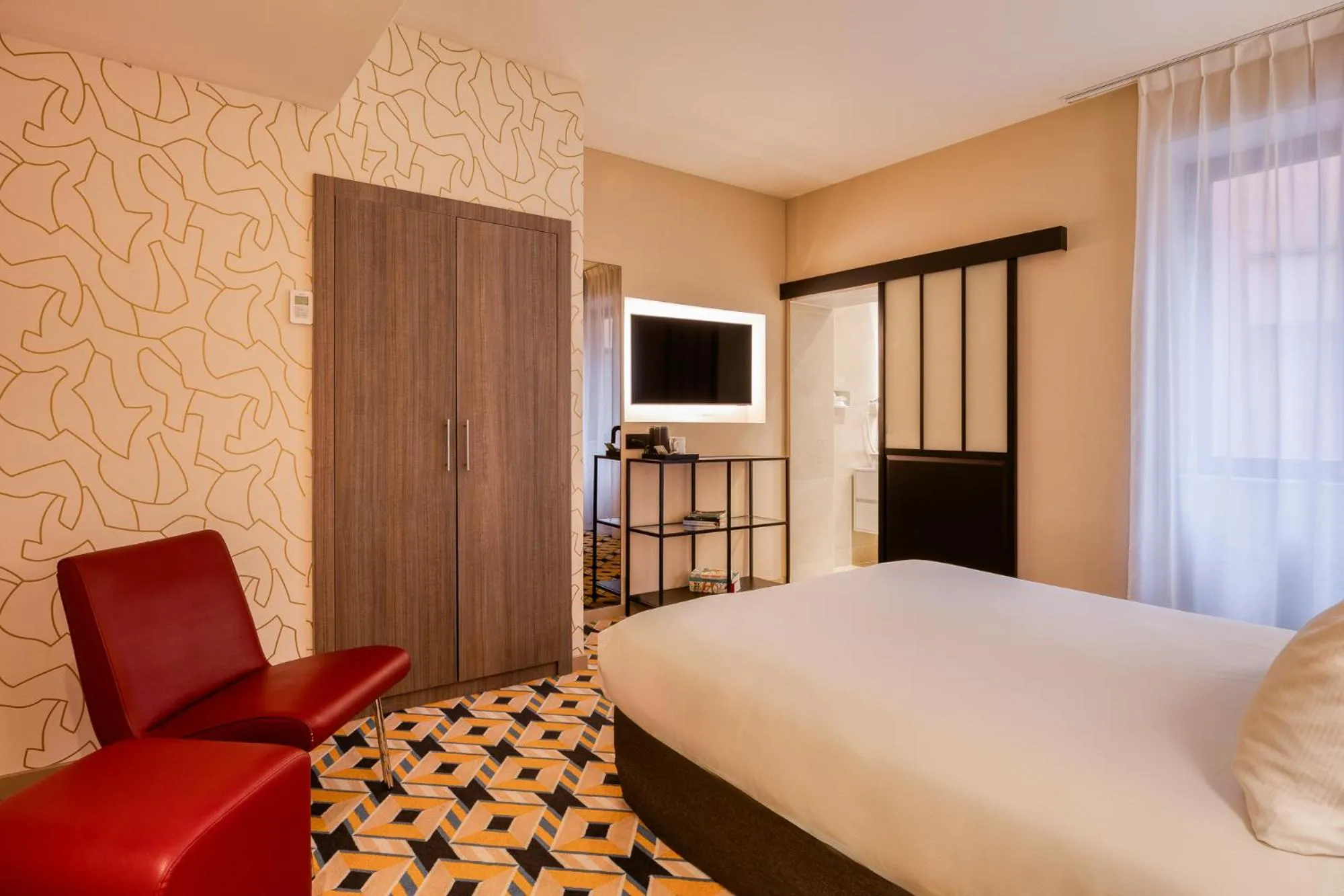 Bed in ALMA Grand Place Hotel