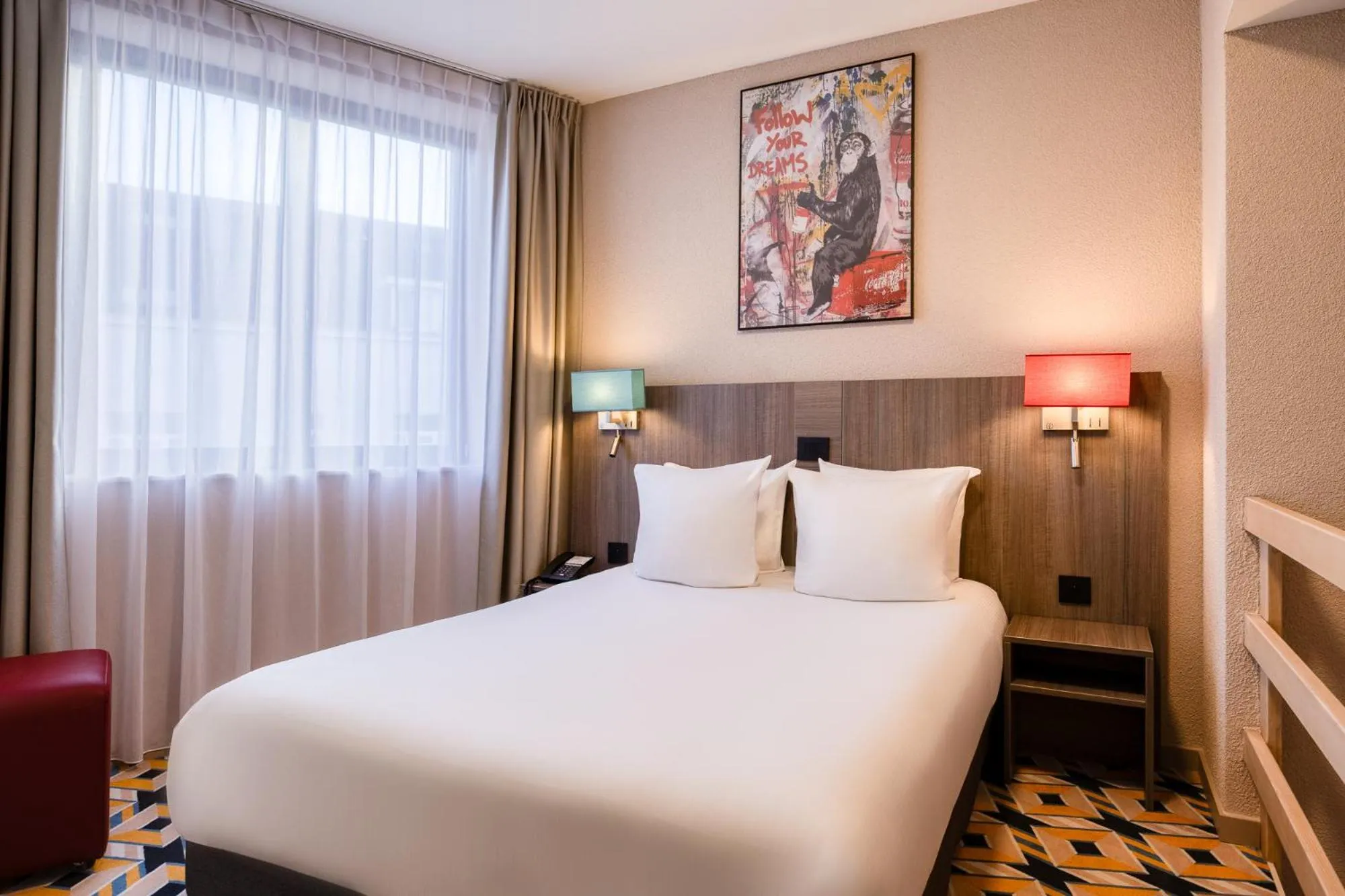 Bed in ALMA Grand Place Hotel