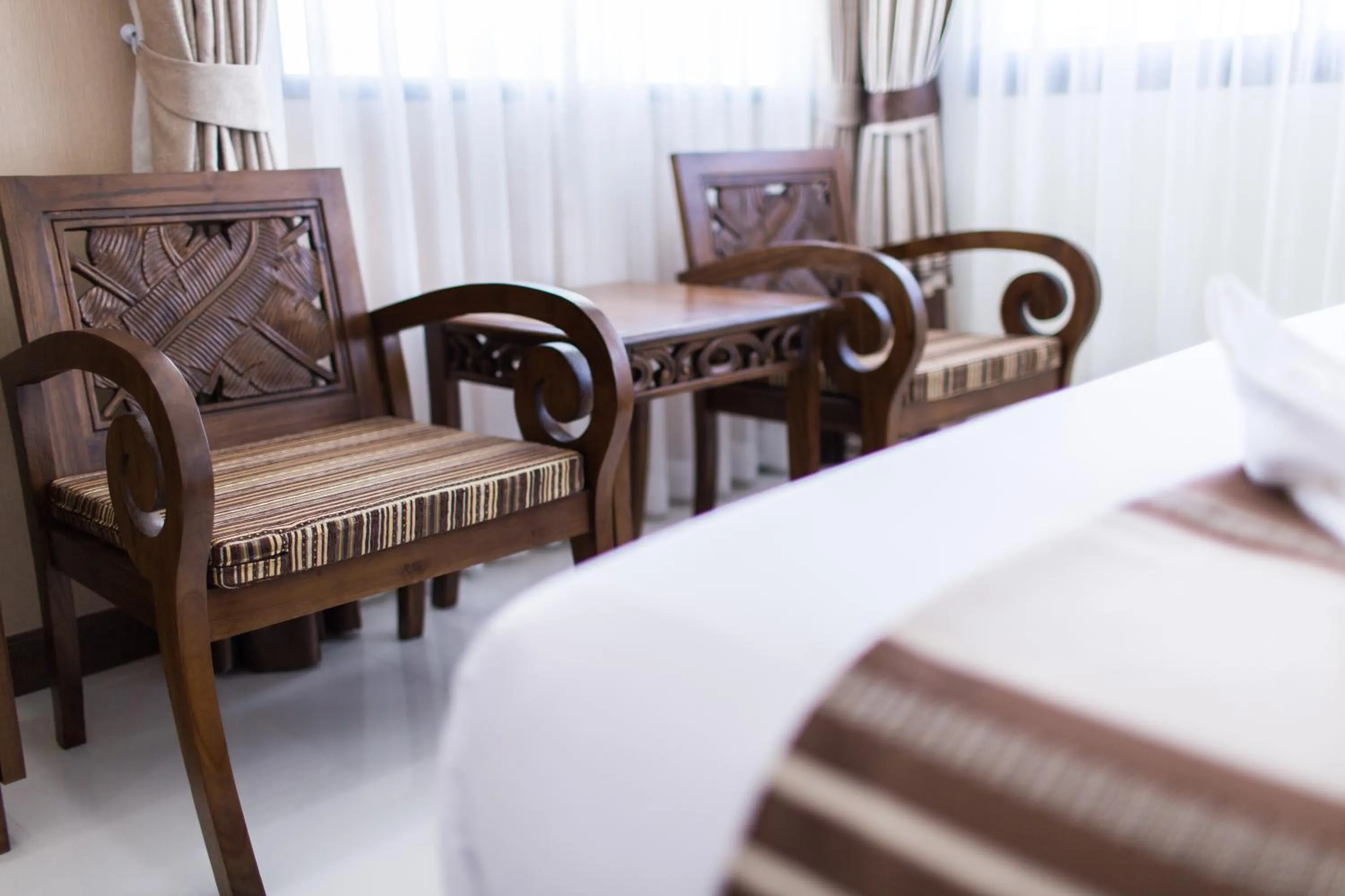 Seating area, Bed in Mhonsa Hotel