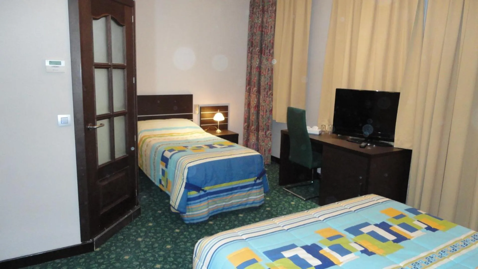 Bed in Hotel L'auberge Du Souverain