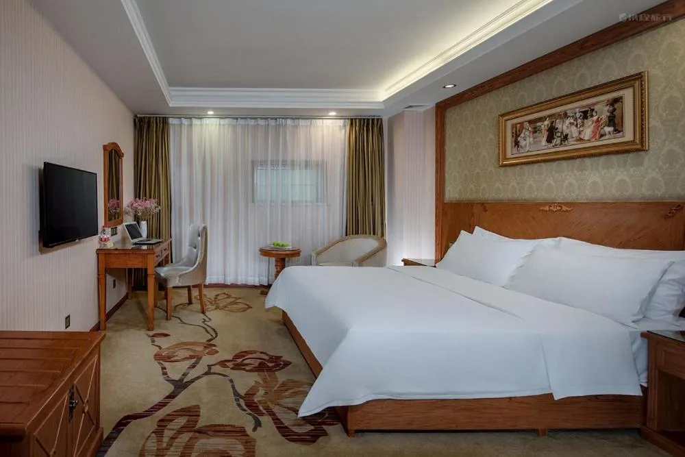 Bed in Vienna Hotel Huizhou Chenjiang Avenue