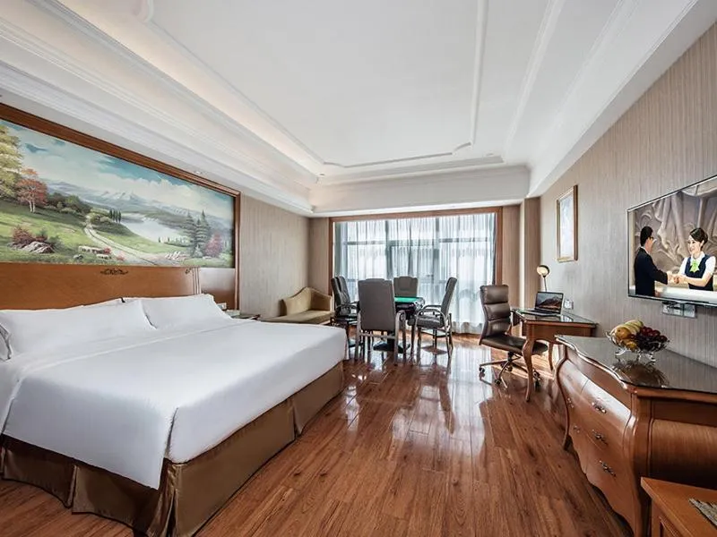 Bed in Vienna International Hotel Xinyang Yangshan New District