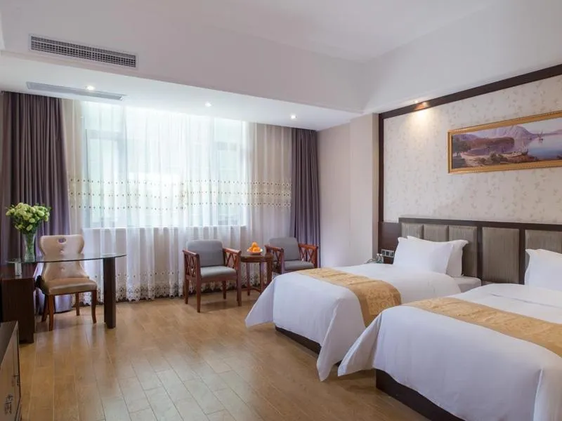 Bed in Vienna International Hotel Jieyang Chaoshan Airport