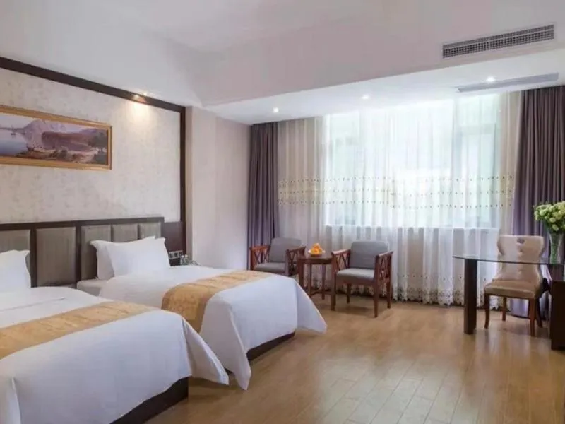 Bed in Vienna International Hotel Jieyang Chaoshan Airport
